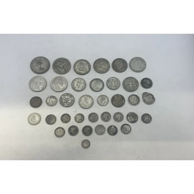 A group of mixed silver coins to include examples from UK (p...