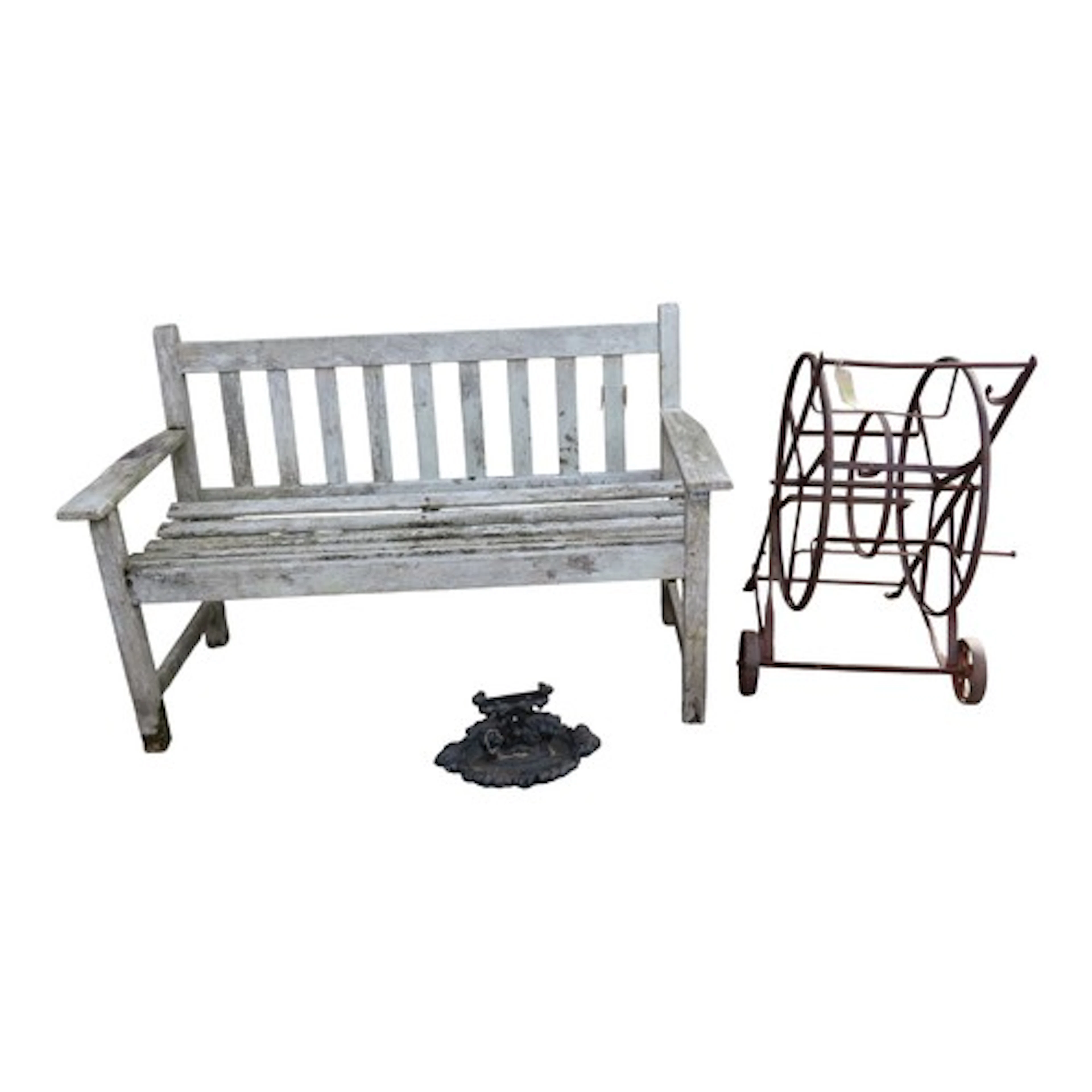 A weathered (silvered) Lister teak two seat garden bench, wi...