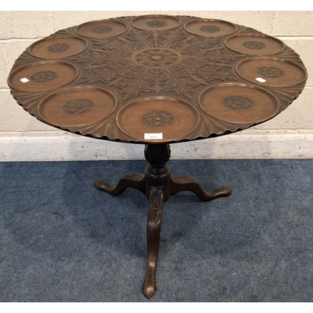 A GEORGIAN MAHOGANY SUPPER TABLE, the spinning tilt top with...