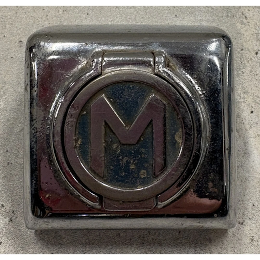 A Morris Oxford bumper starting handle cover. Est. £20 - £30...