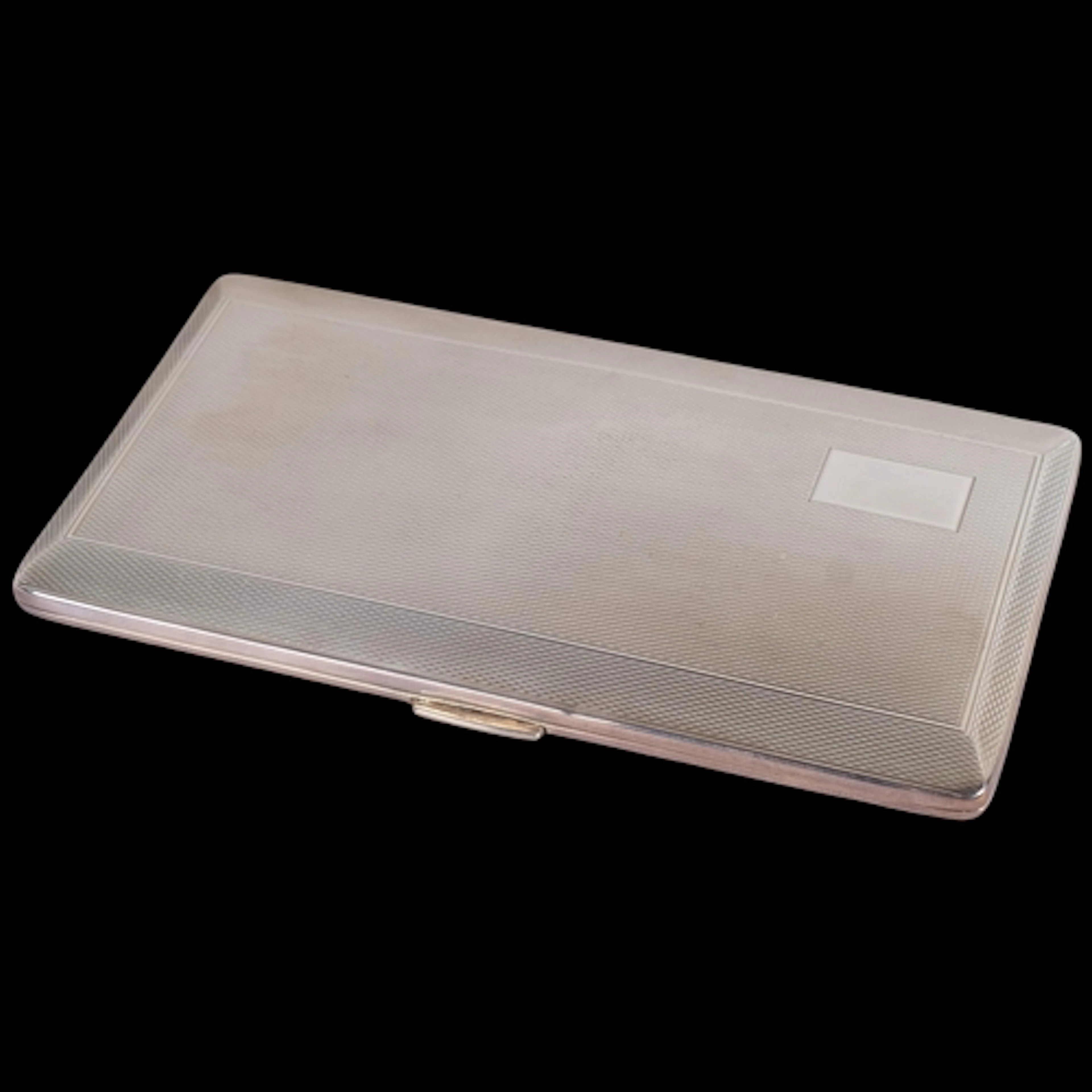 An Art Deco style Elizabeth II silver cigarette case, Harman...
