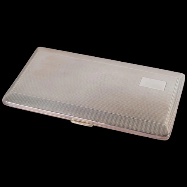 An Art Deco style Elizabeth II silver cigarette case, Harman...