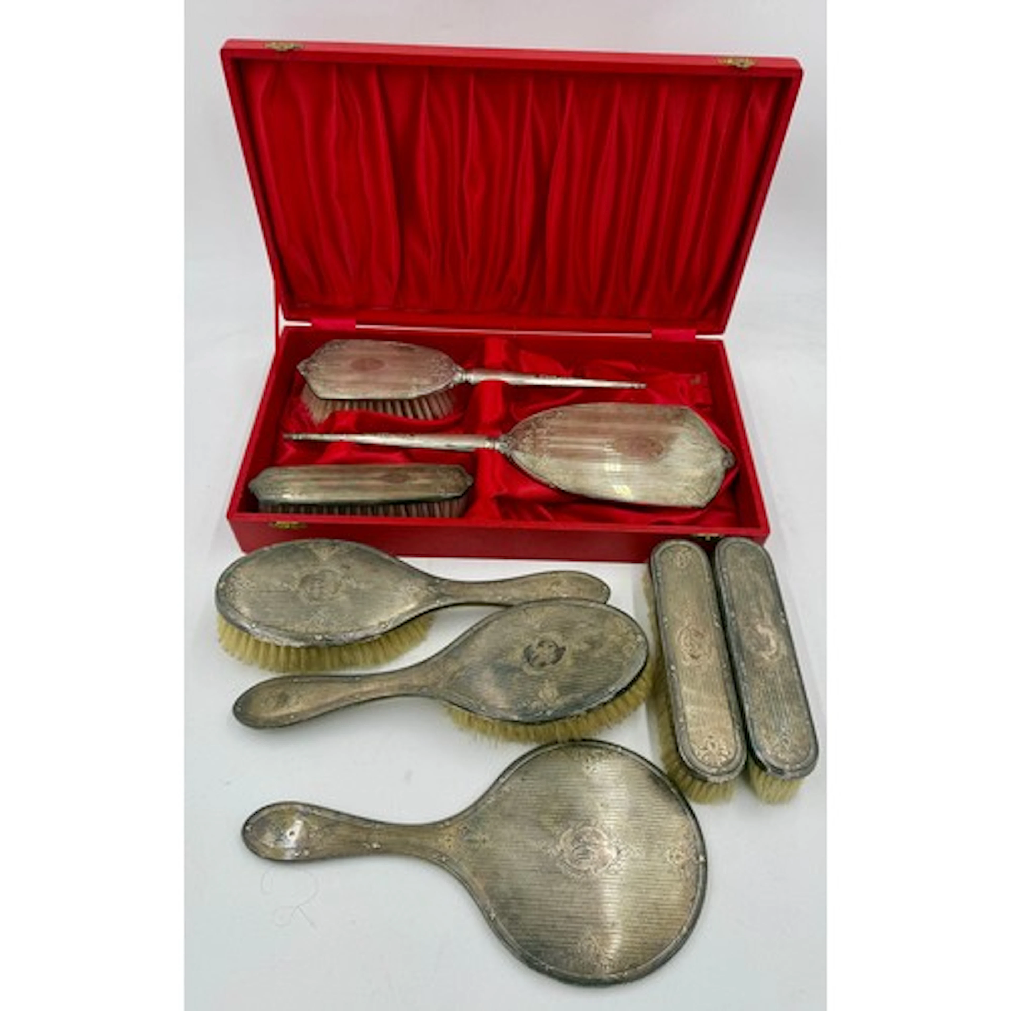 Two hallmarked silver backed dressing table sets, one boxed,...