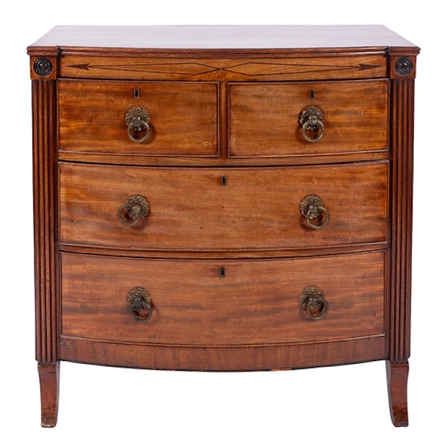 A George IV mahogany bowfront chest of drawers, circa 1825; ...