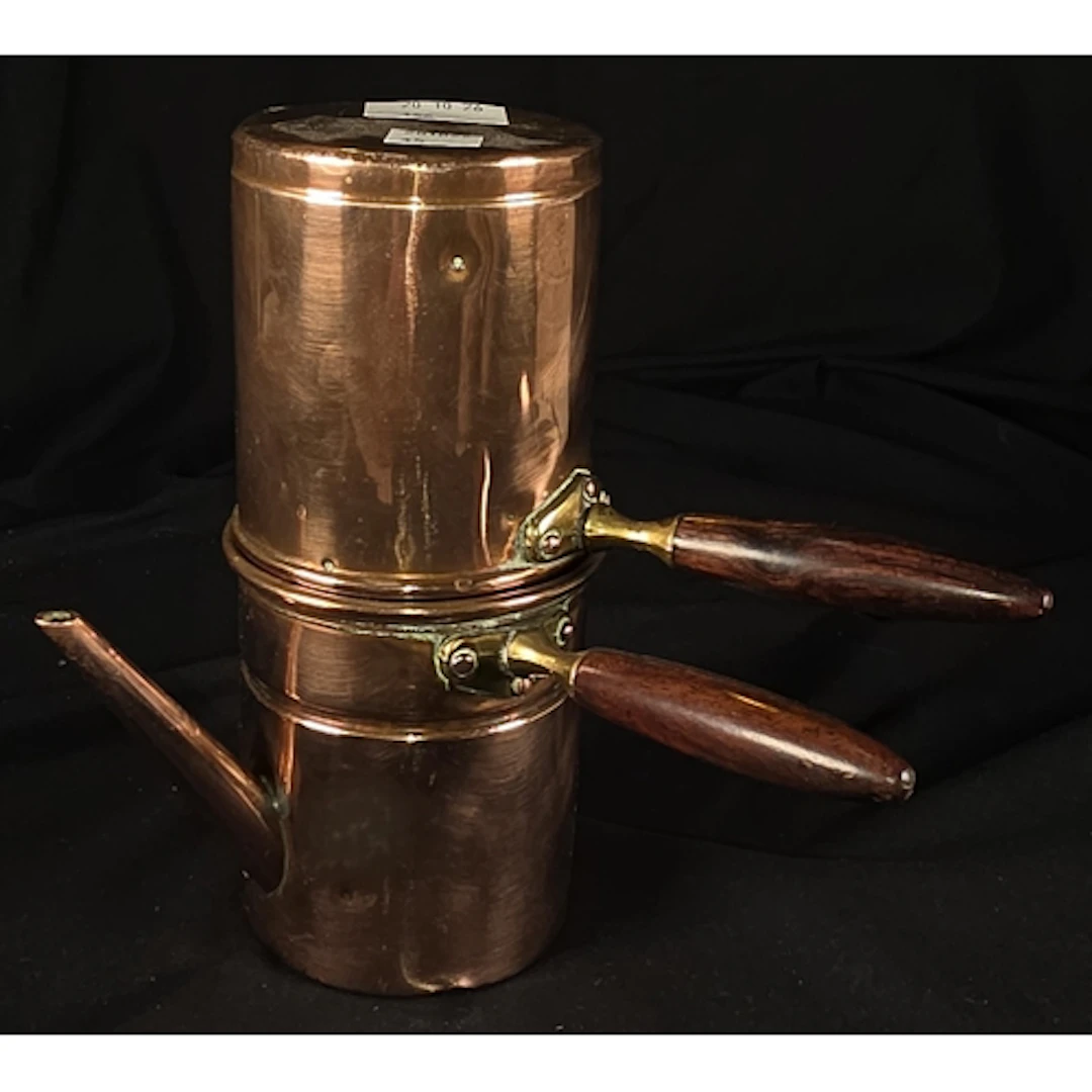 A vintage copper flip-drip coffee maker, with pour spout bel...