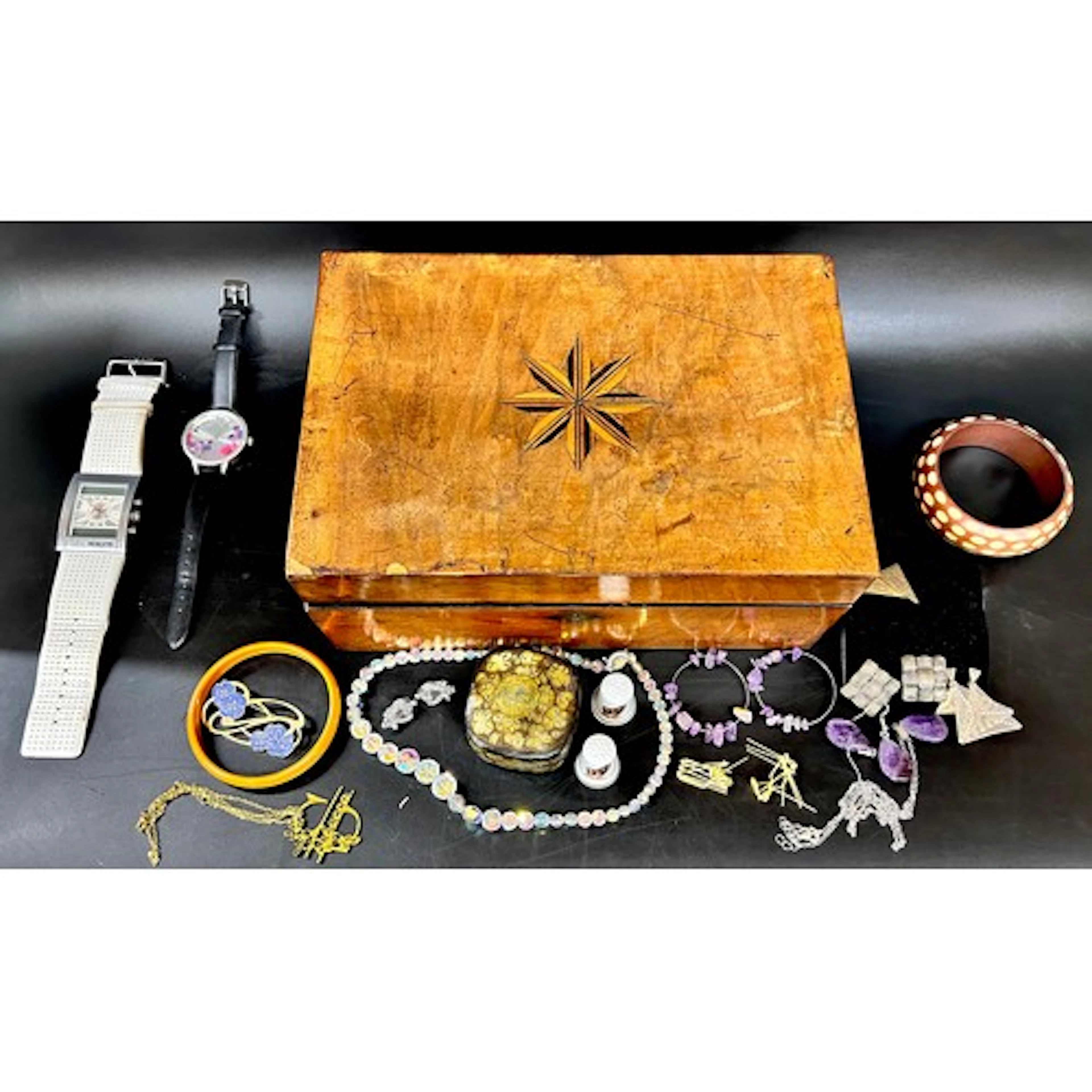 A collection of costume jewellery in an Edwardian walnut inl...