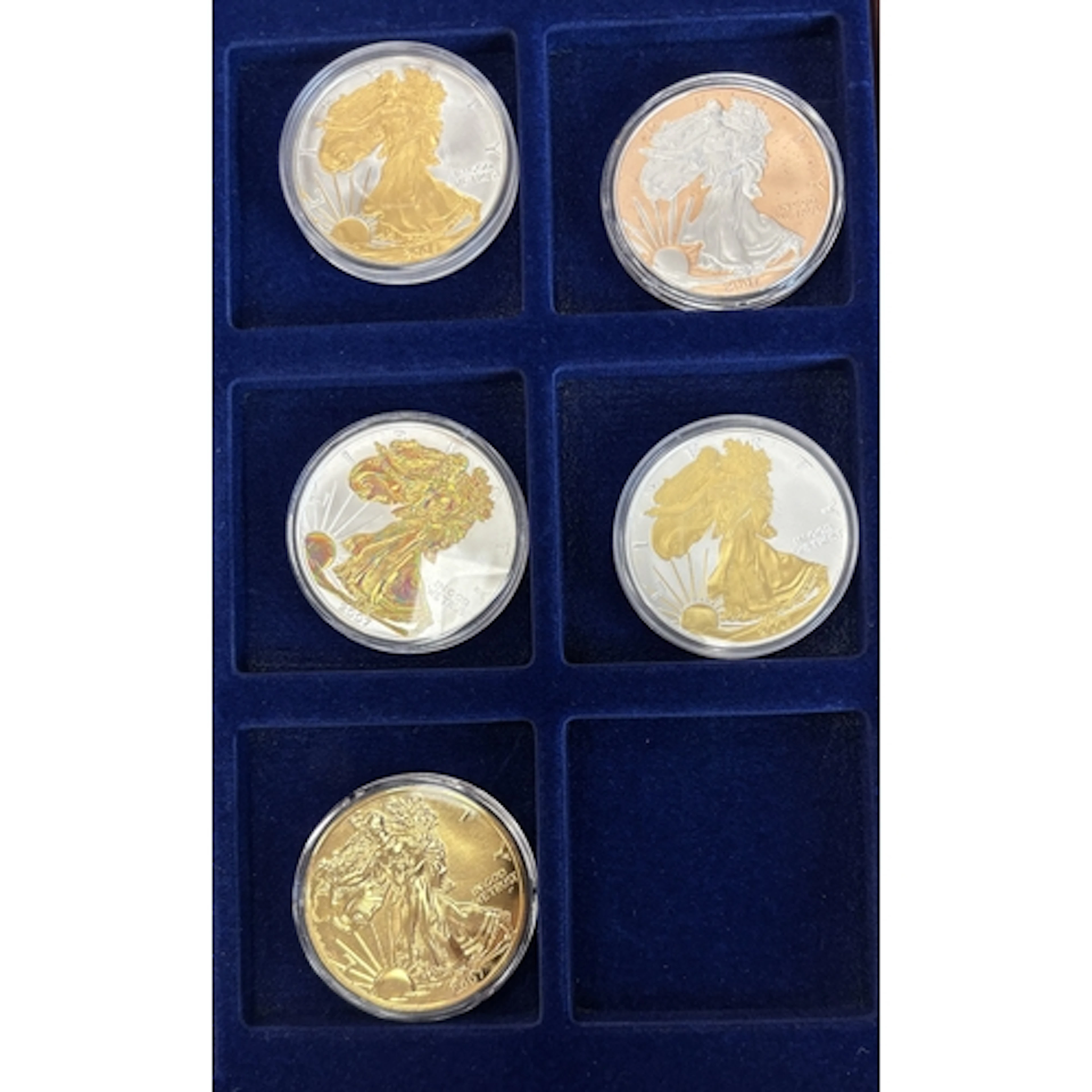 USA. Range of uncirculated Walking Liberty silver dollars in...