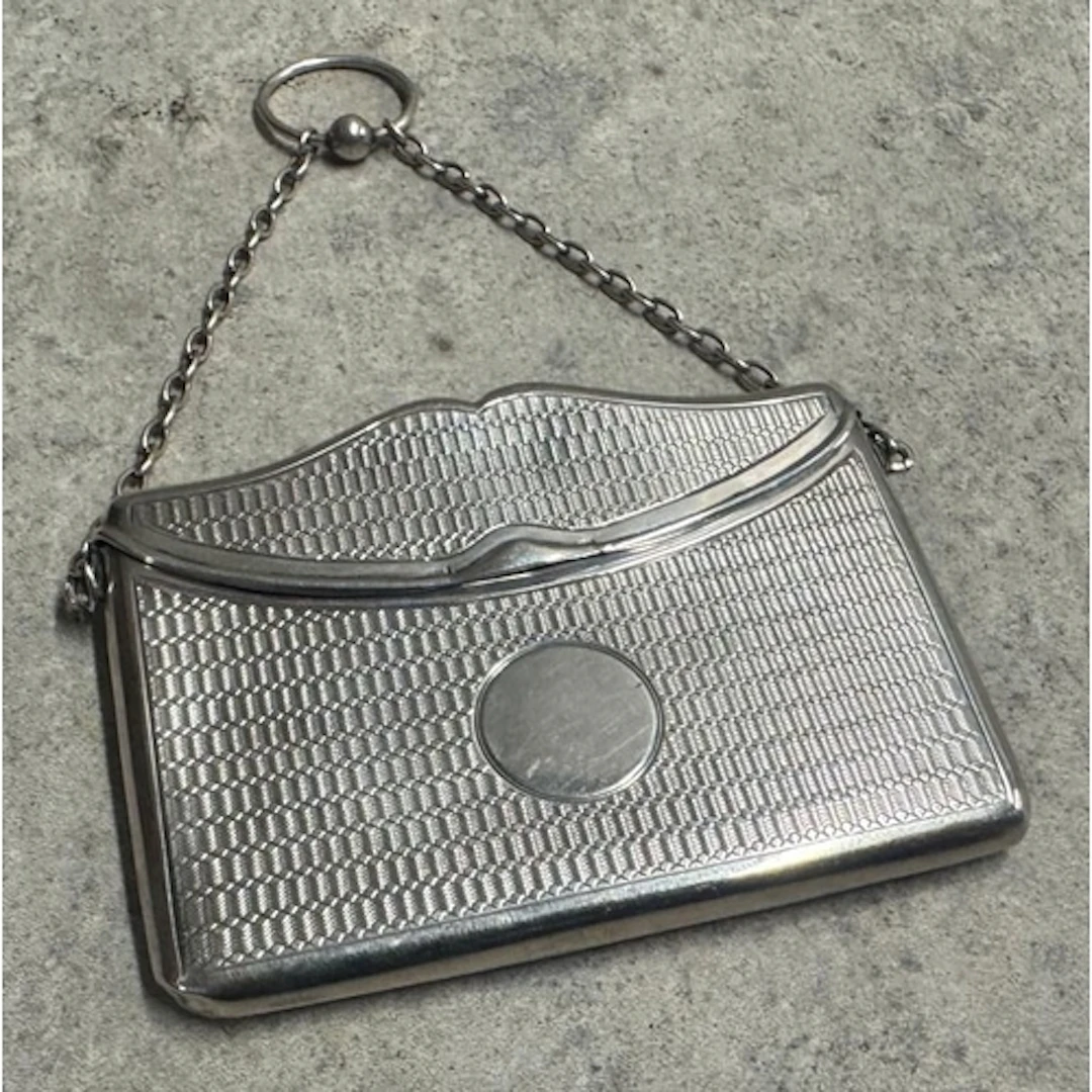 A silver card case in the form of an envelope. Birmingham 19...