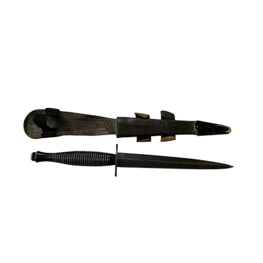 An FS fighting knife of conventional form, the cross piece s...