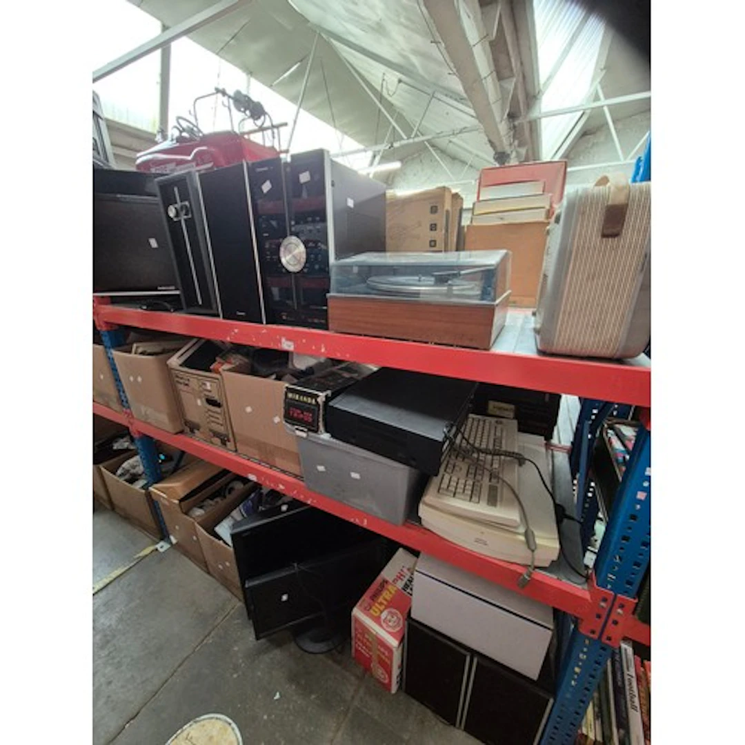 Three shelves of mixed items to include 2 tv sets, 2 compute...