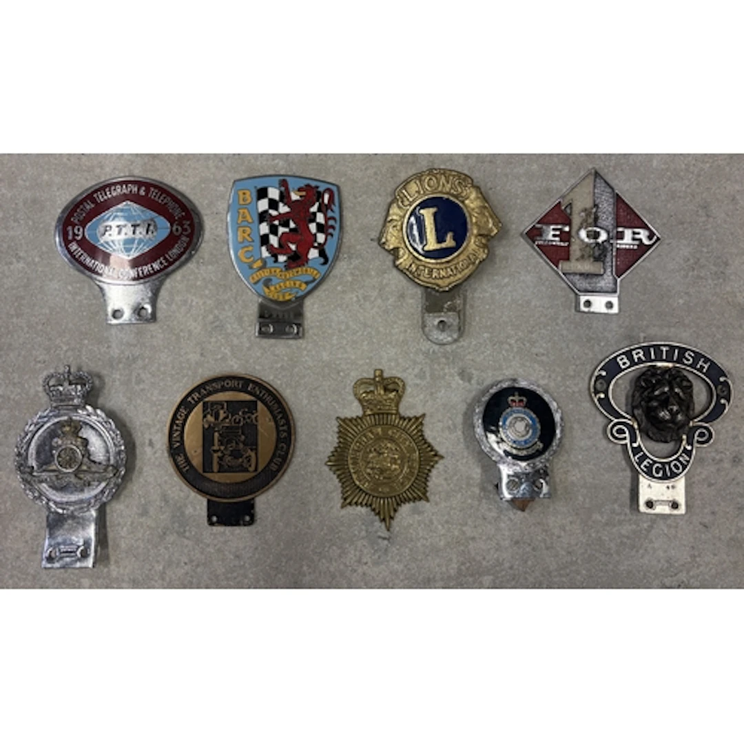 A collection of nine car badges to include Fellowship of Rid...