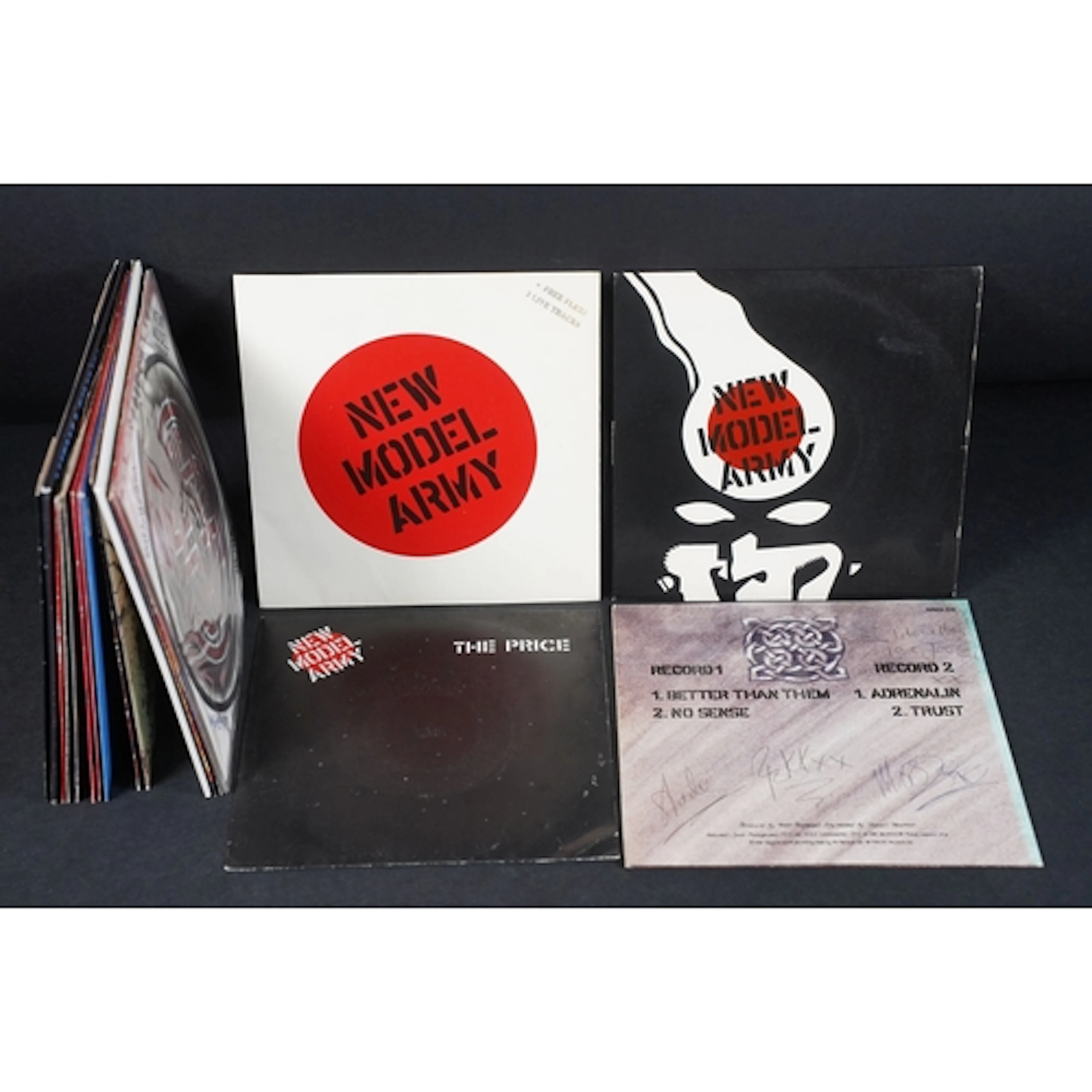 Vinyl / Autographs - 19 New Model Army 7” singles including ...