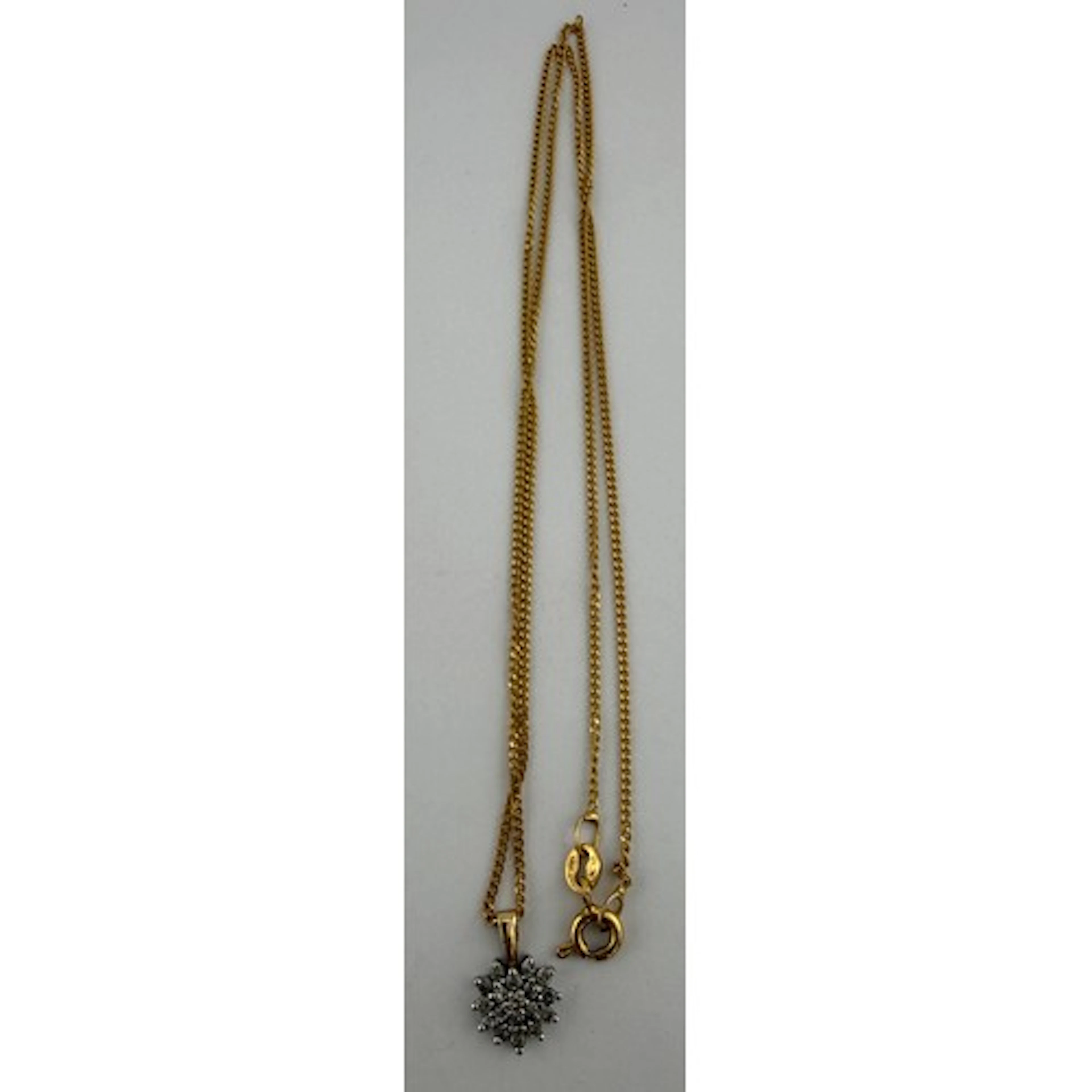 A nine carat gold chain with diamond set pendant. Chain 40cm...