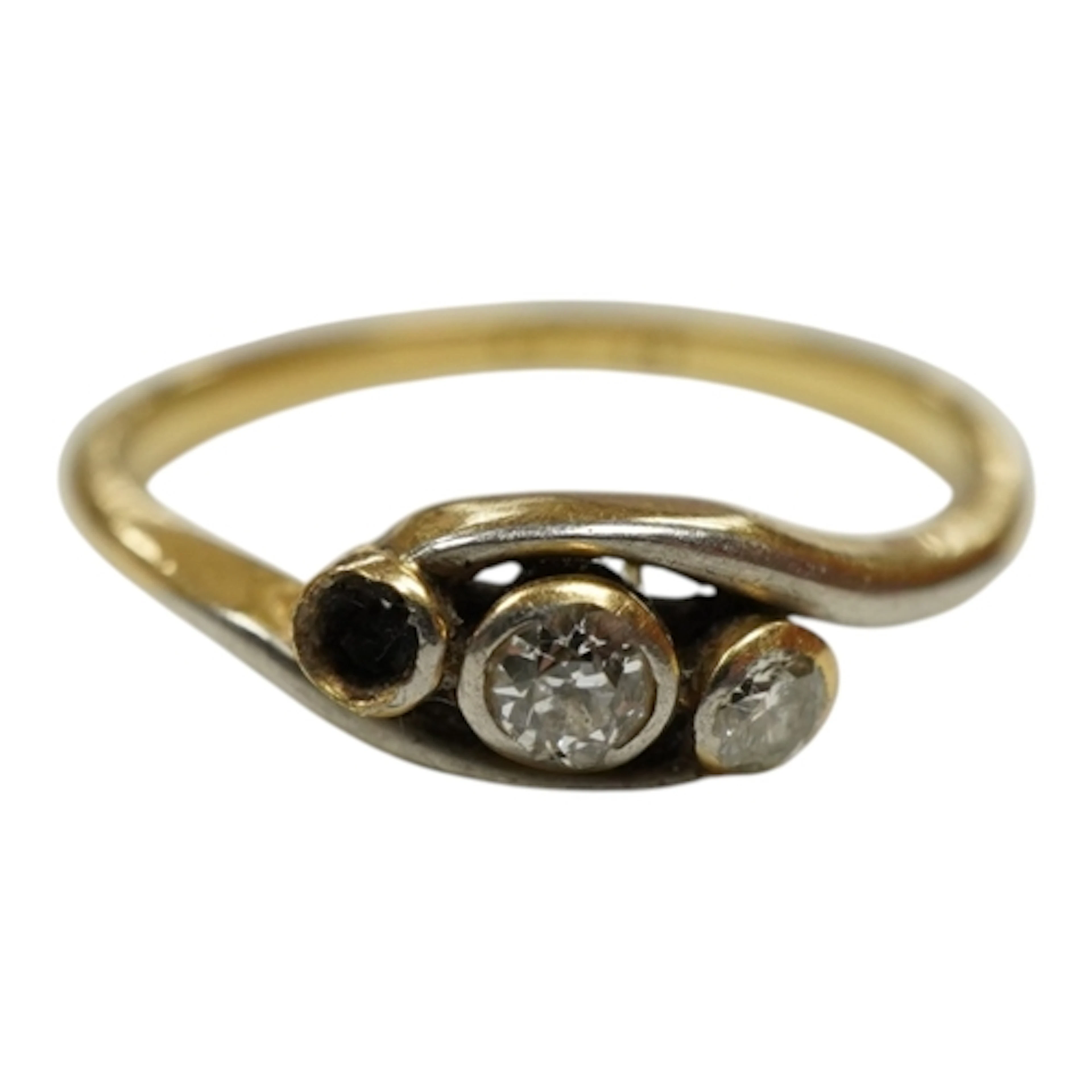 An 18ct and diamond three stone diamond set crossover ring, ...