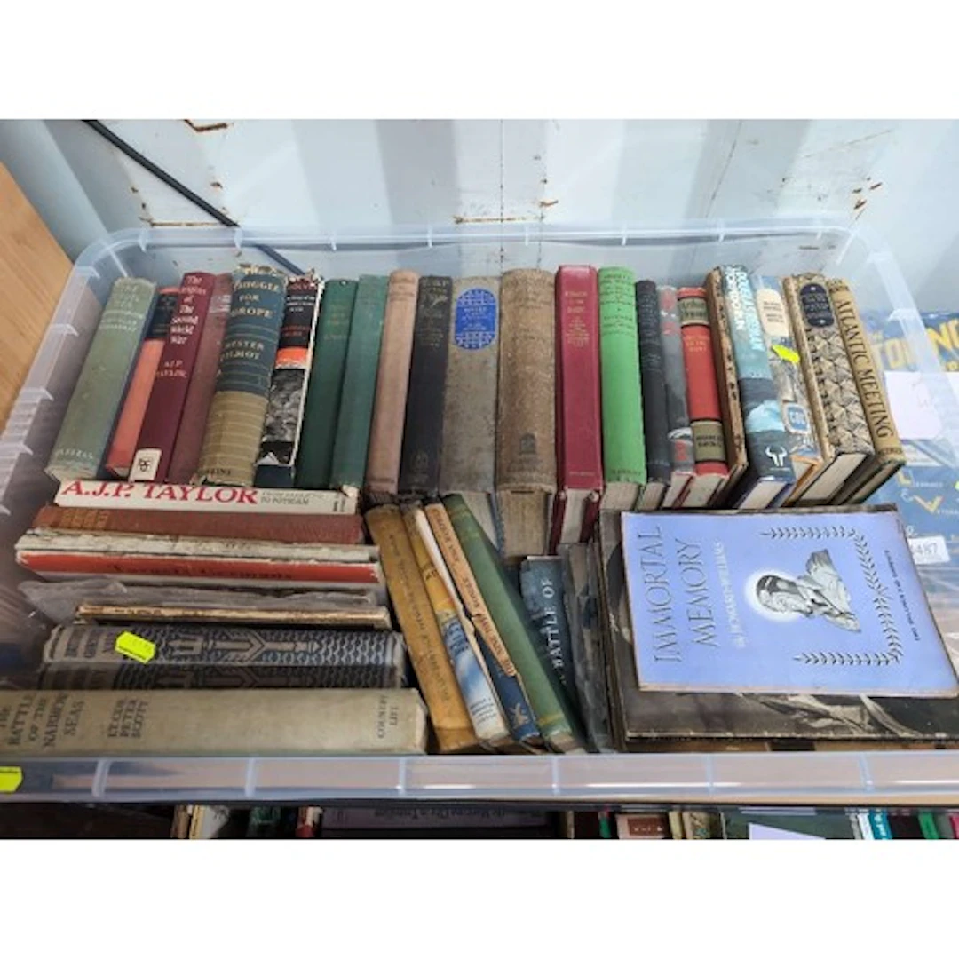 A box containing "WW2" books & booklets.
