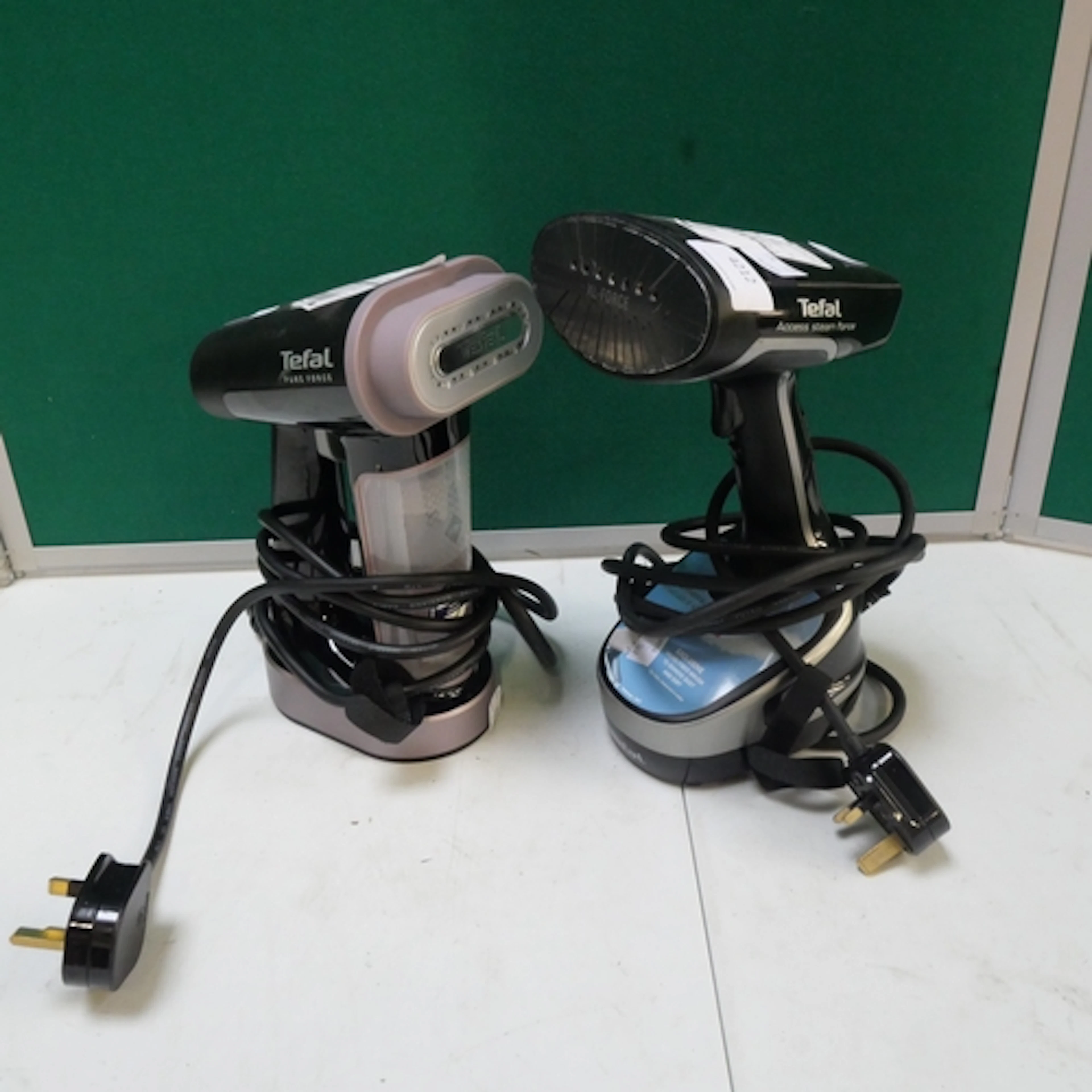 A Tefal steam force garment steamer and a Tefal Pure Force 3...