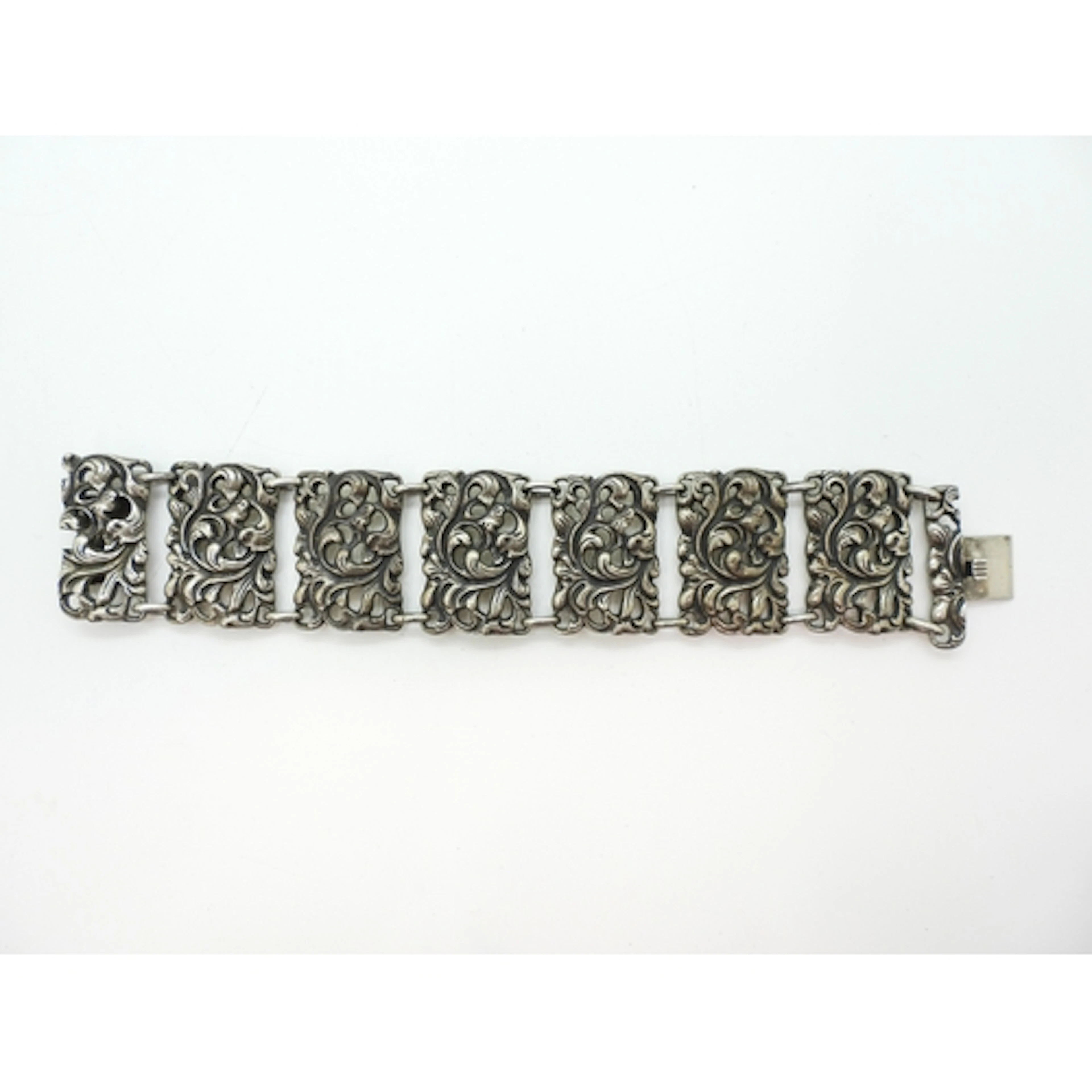 A silver Scandinavian floral scroll panel bracelet, stamped ...
