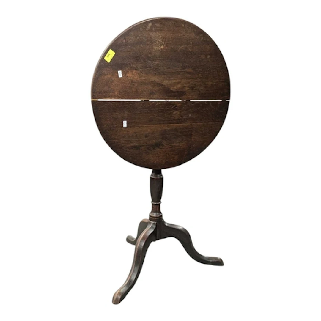 An early 19th century George III oak tripod wine table. The ...