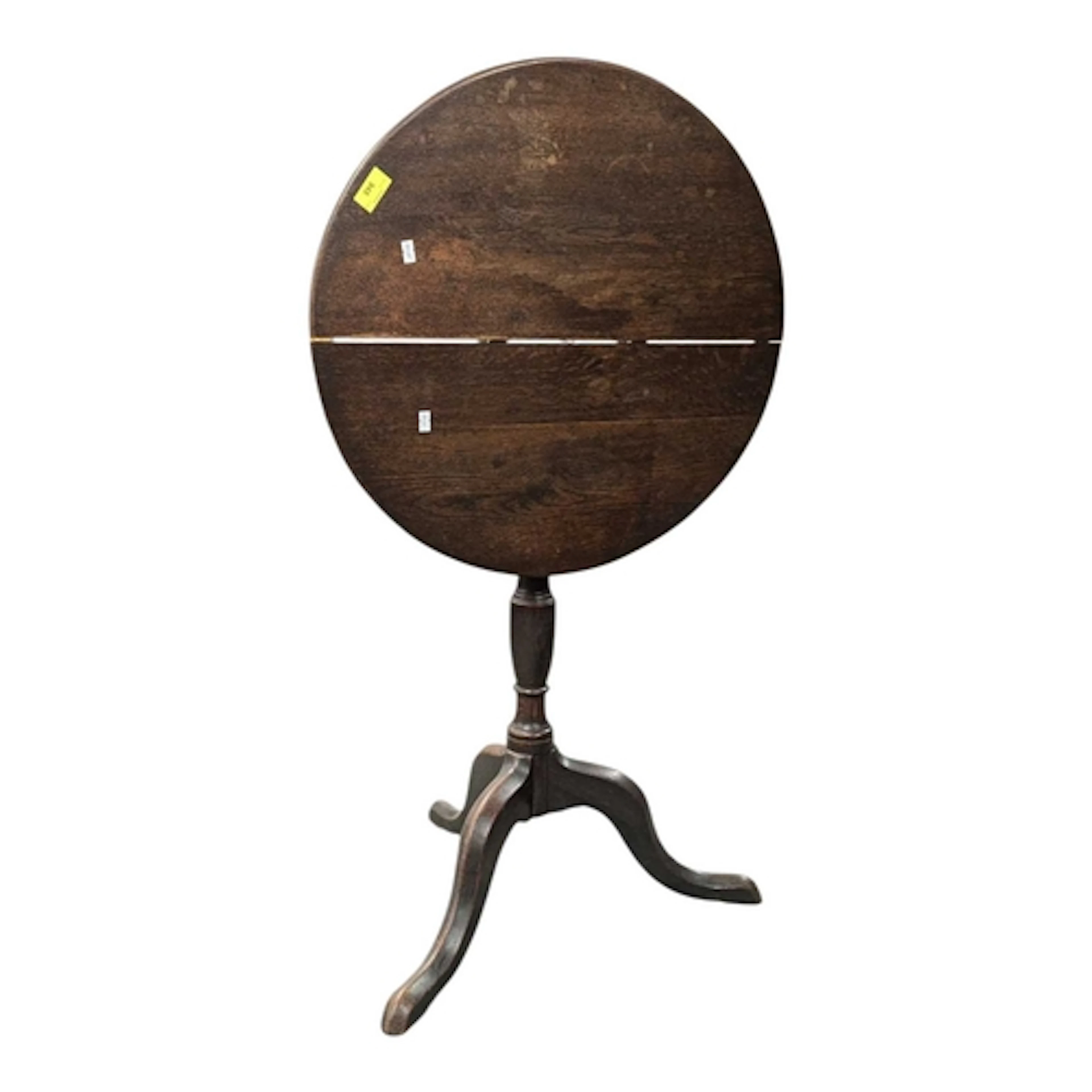An early 19th century George III oak tripod wine table. The ...