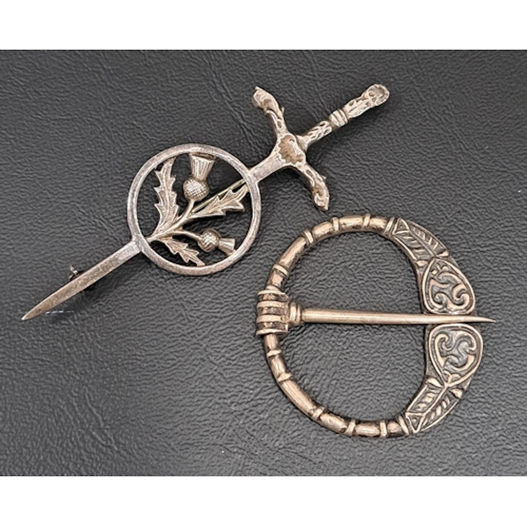 ALEXANDER RITCHIE IONA SILVER PENANNULAR BROOCH with motif a...