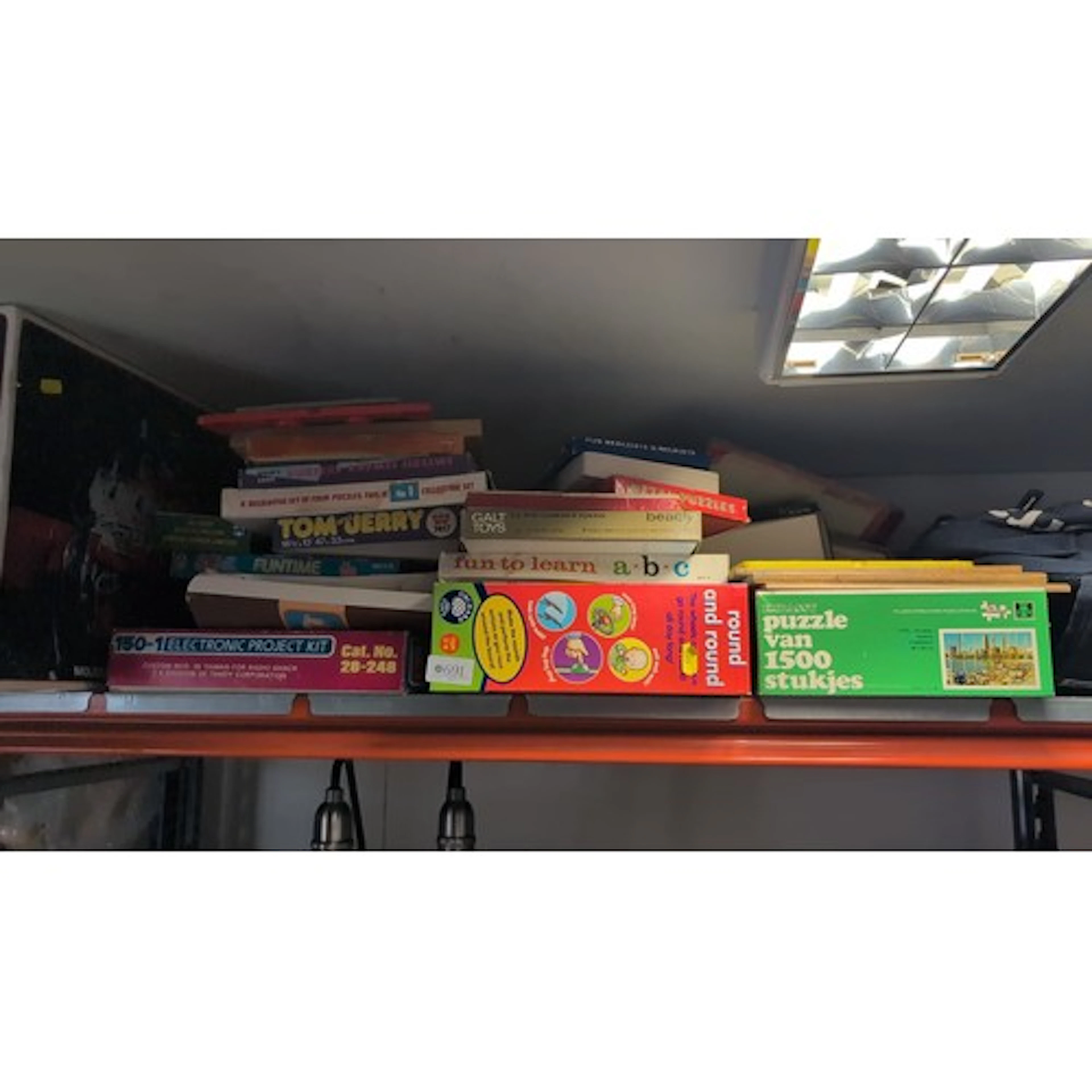 A collection of vintage children’s games and puzzles, includ...