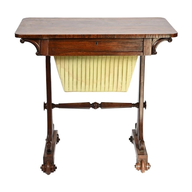 A George IV rosewood work table, with oblong top, C-scroll b...