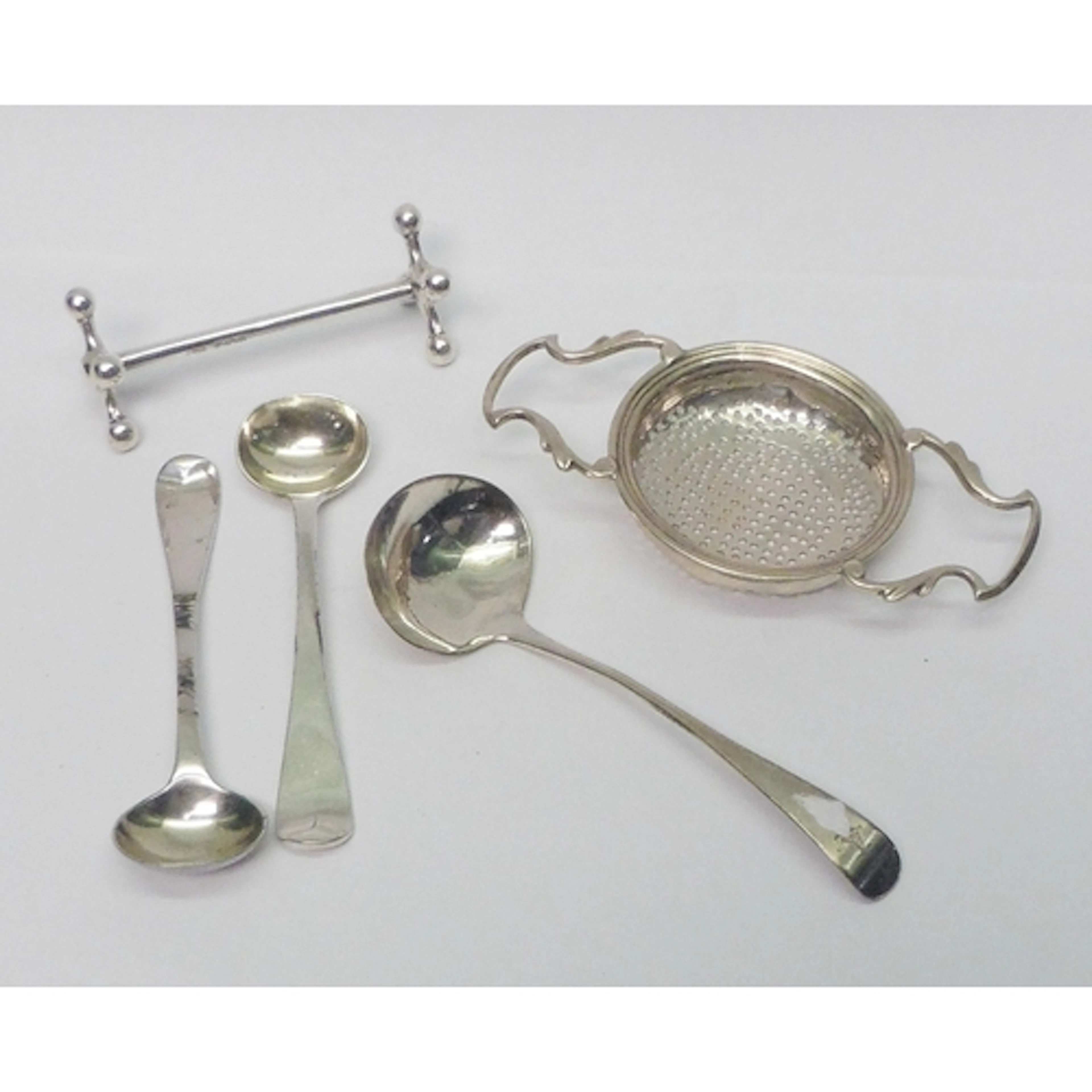 A Scottish silver tea strainer, Hamilton & Inches, Edinburgh...