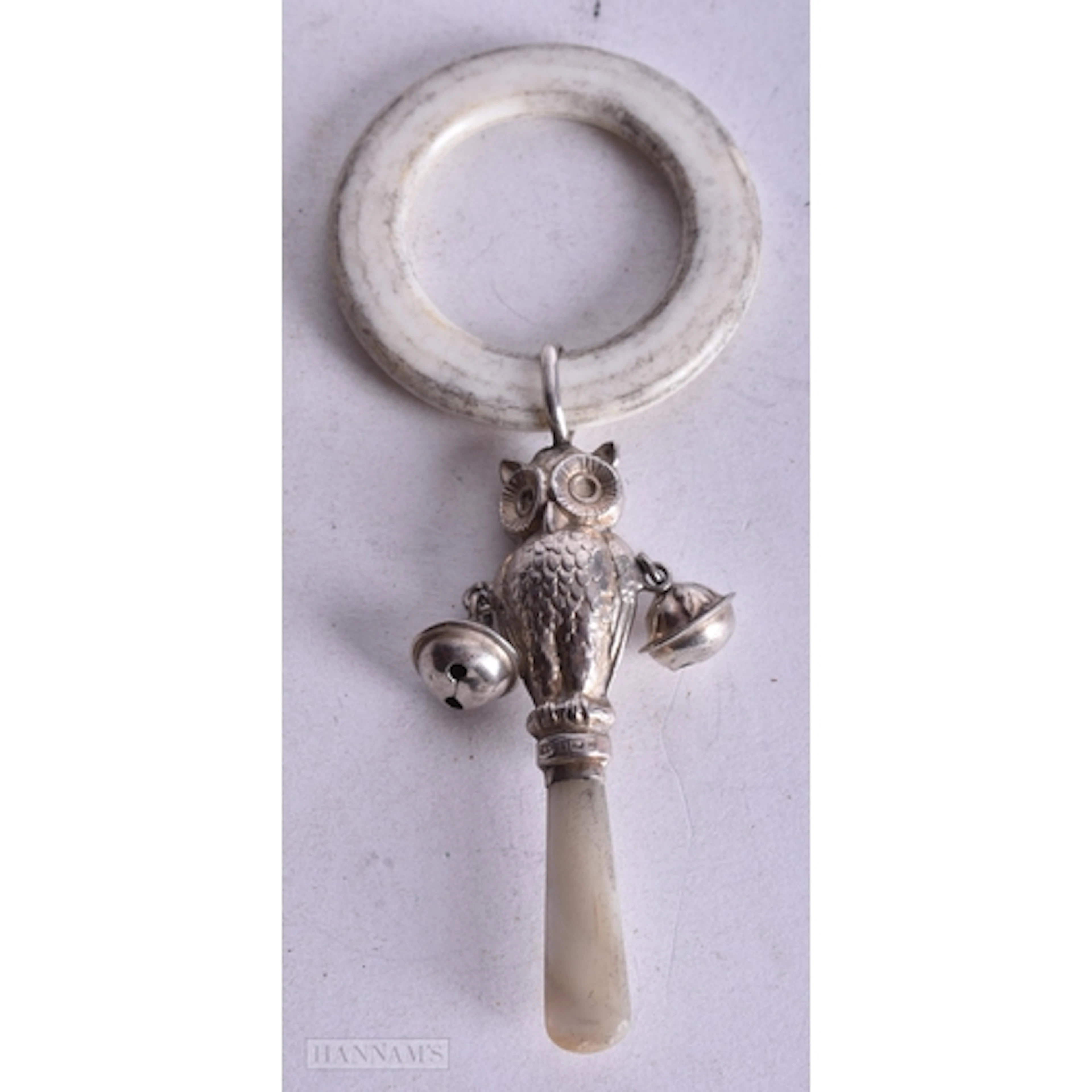 AN ANTIQUE SILVER OWL BABIES RATTLE. 14 cm long.