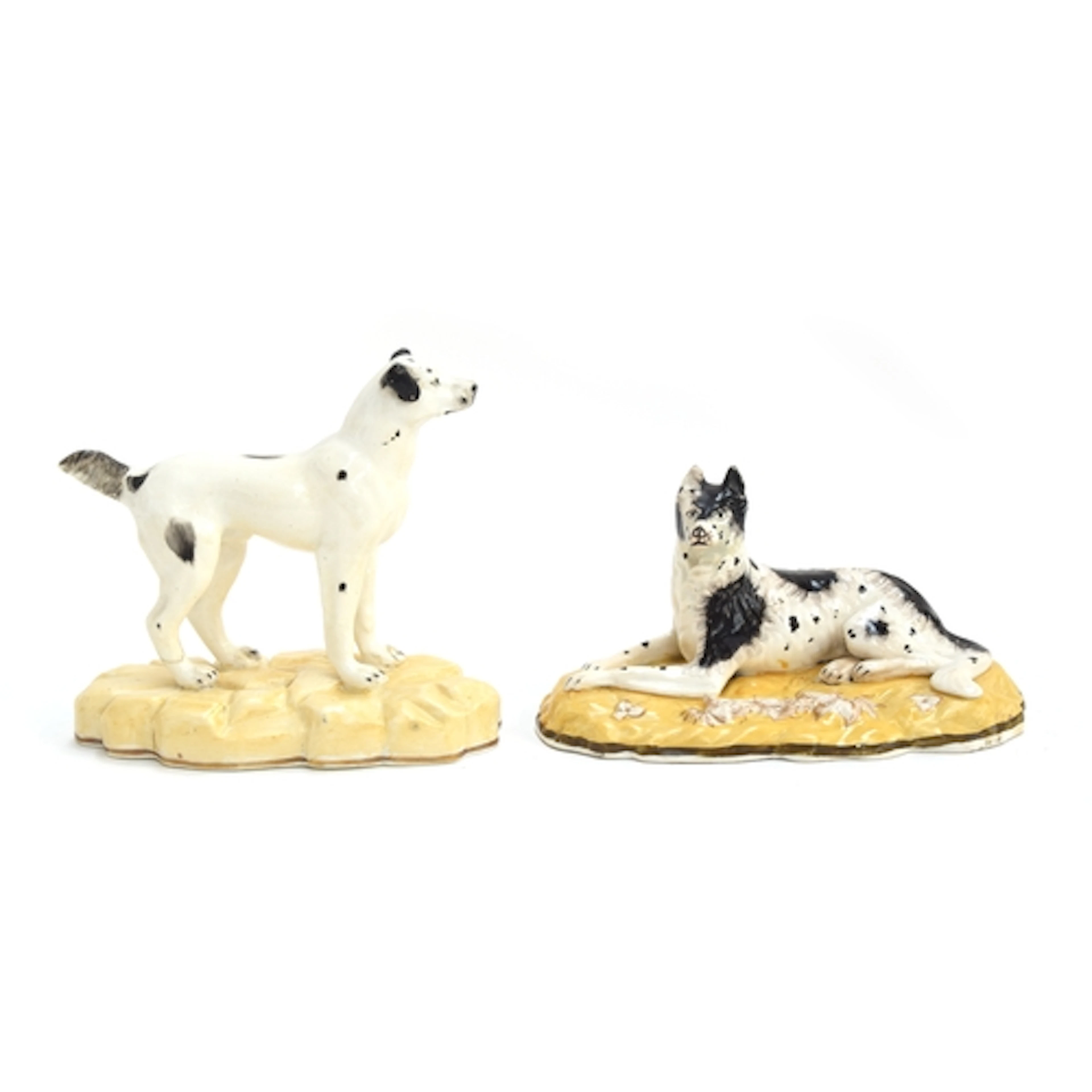 A 19th century Staffordshire porcelain figure of a recumbent...