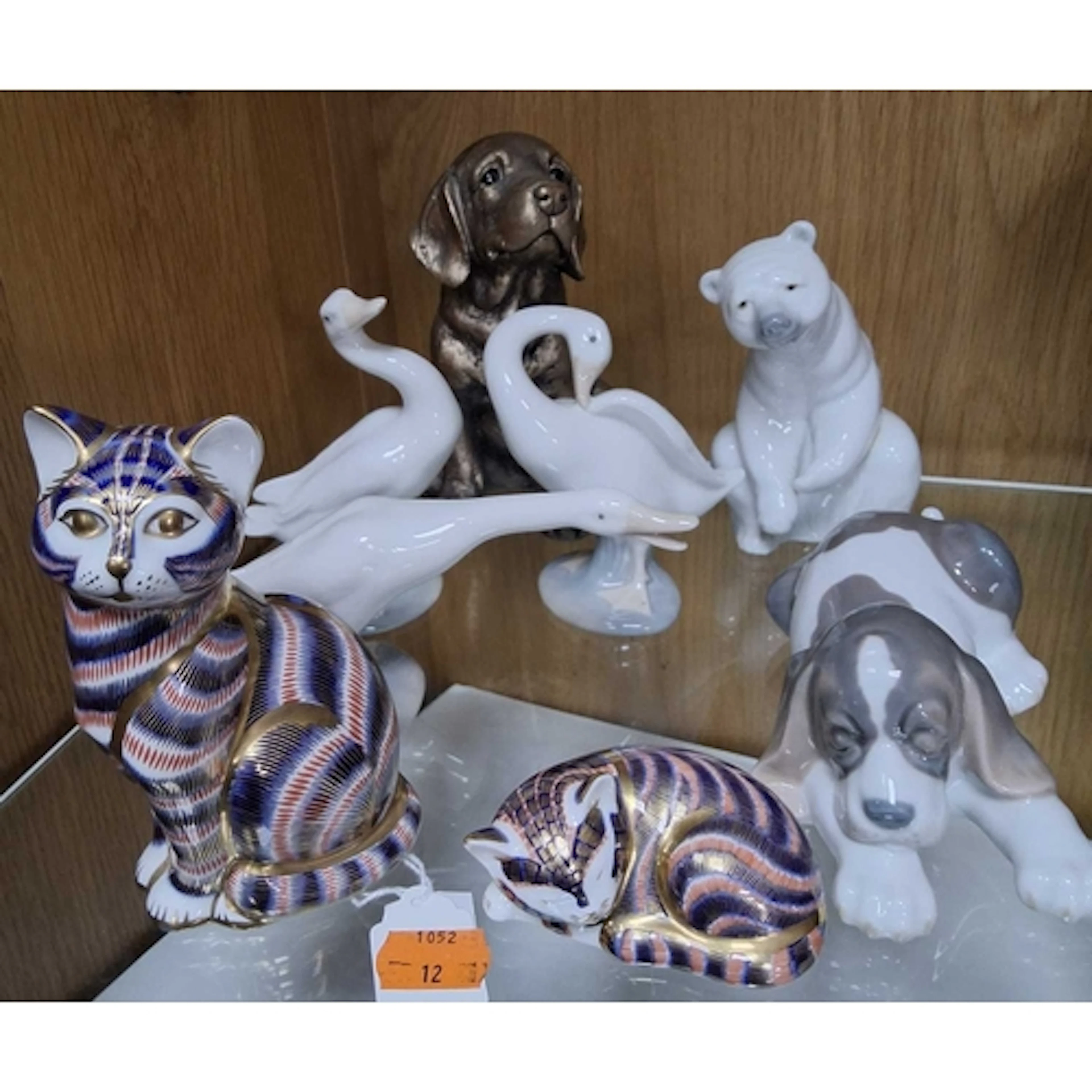 A GROUP OF ROYAL CROWN DERBY AND LLADRO CERAMICS, comprising...