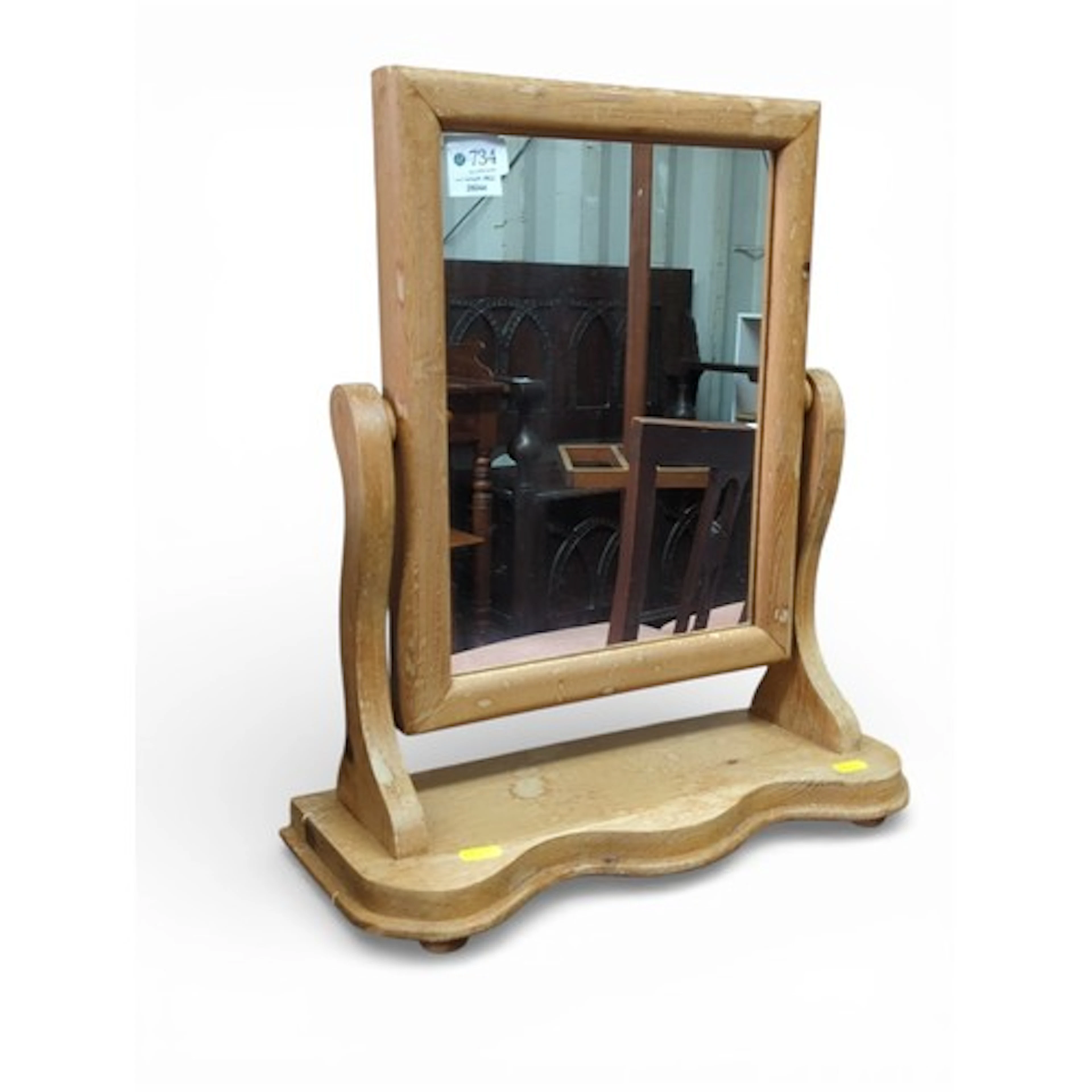 A freestanding dressing-table mirror in pine, the rectangula...