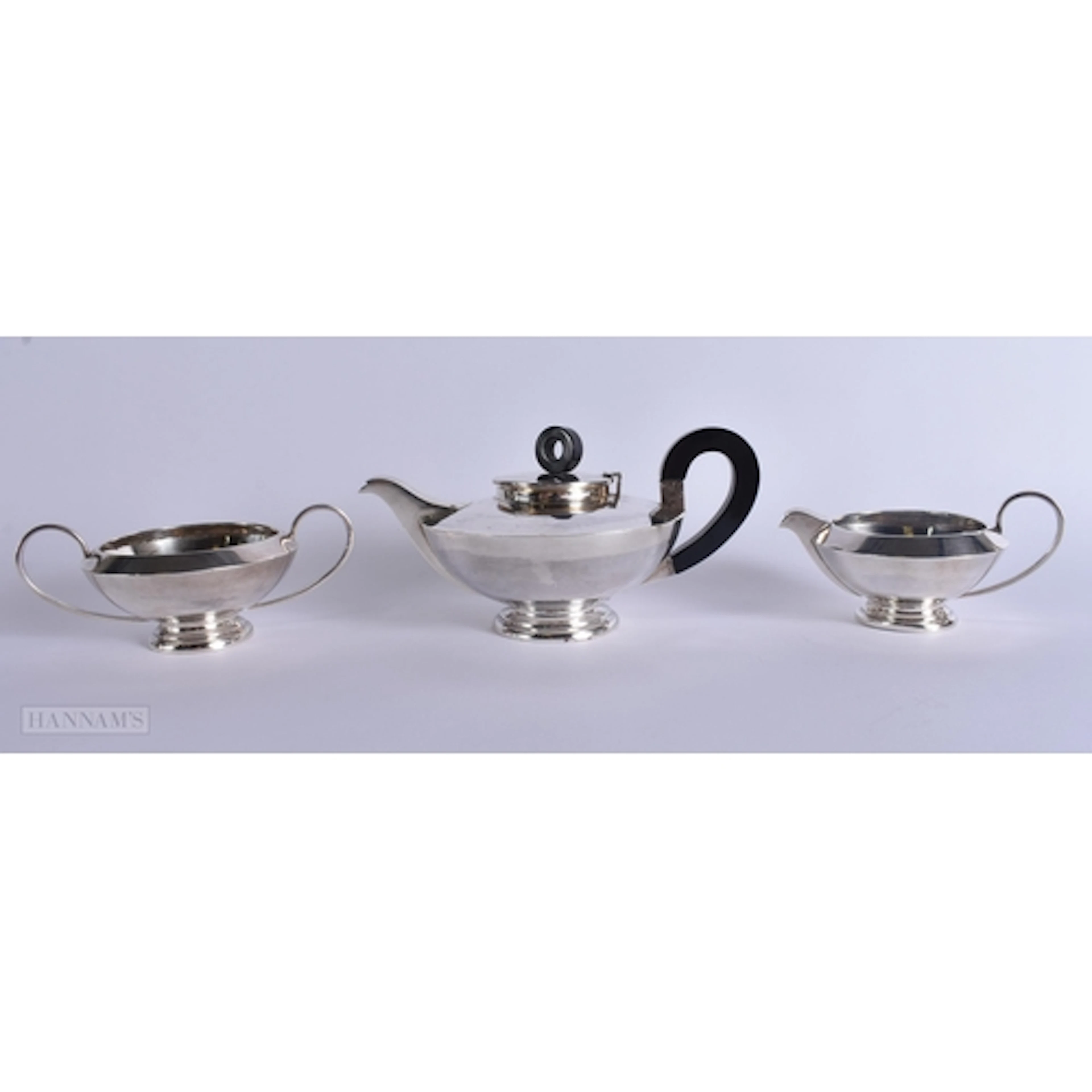 AN ART DECO SILVER TEASET. 728 grams. Largest 18.5 cm wide. ...