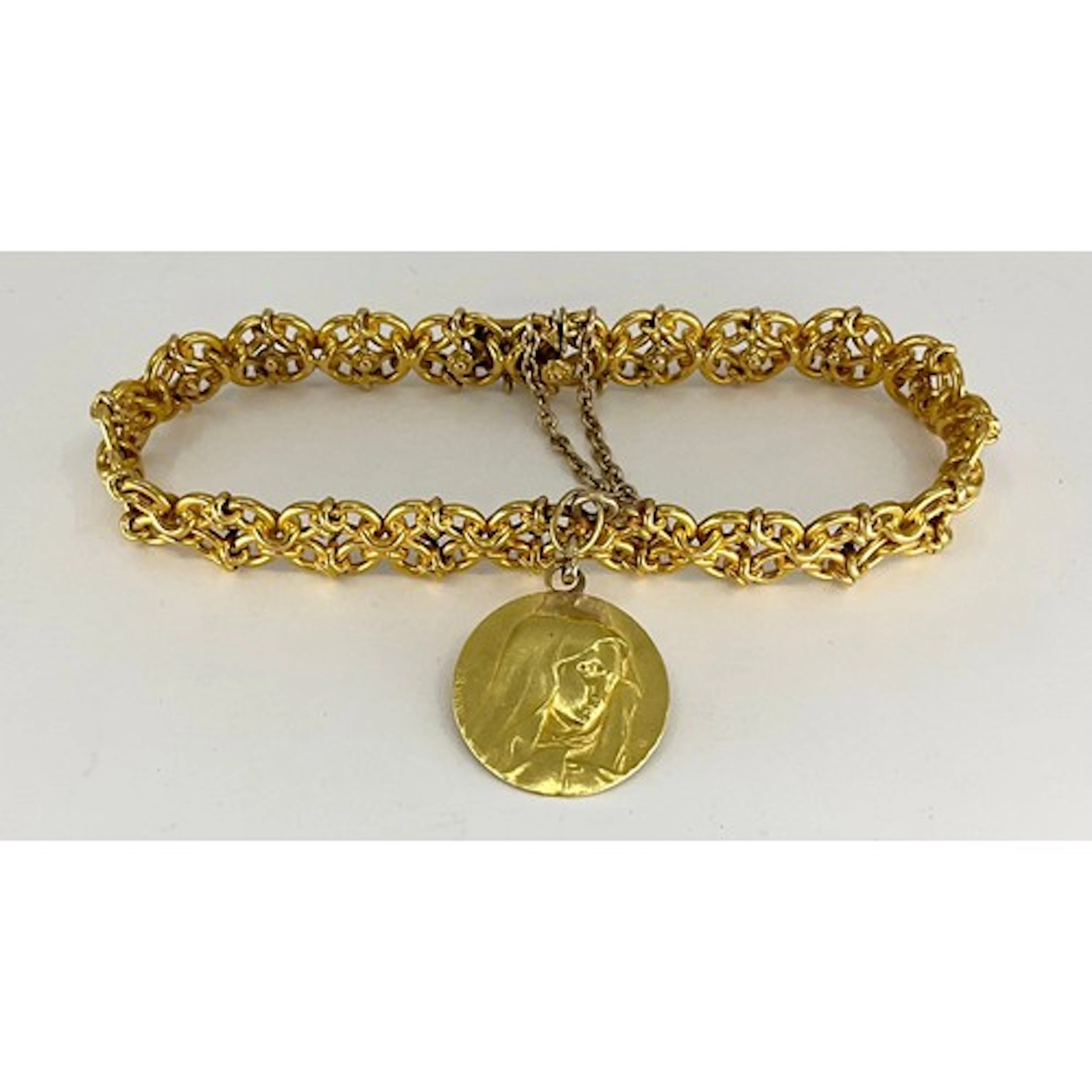 A continental yellow metal fancy link bracelet, with floral ...