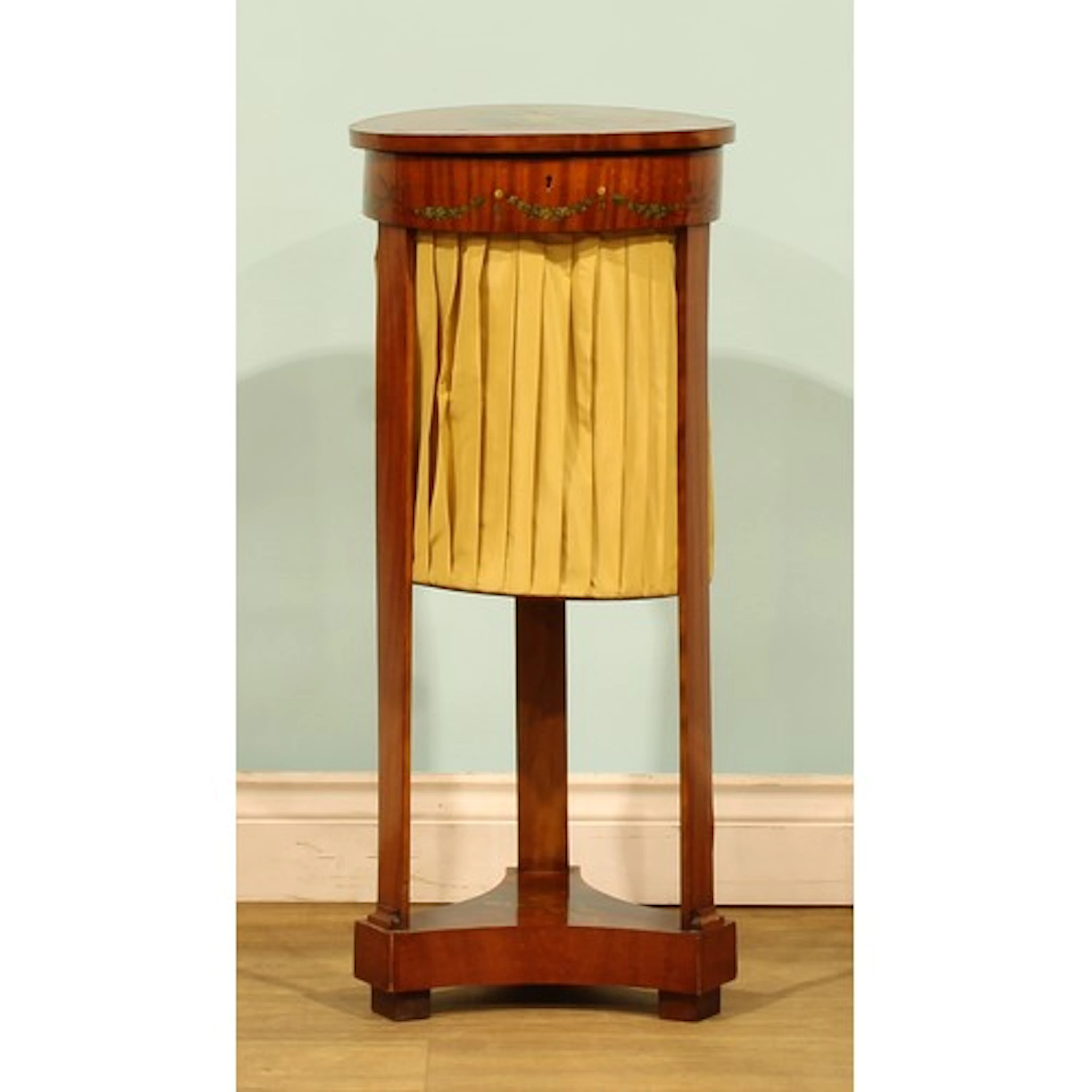 A Sheraton Revival painted satinwood work table, hinged top,...