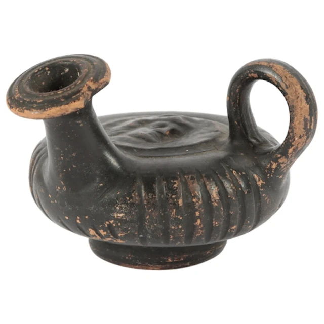 A Greek Apulian black glazed earthenware guttus, circa 300 B...