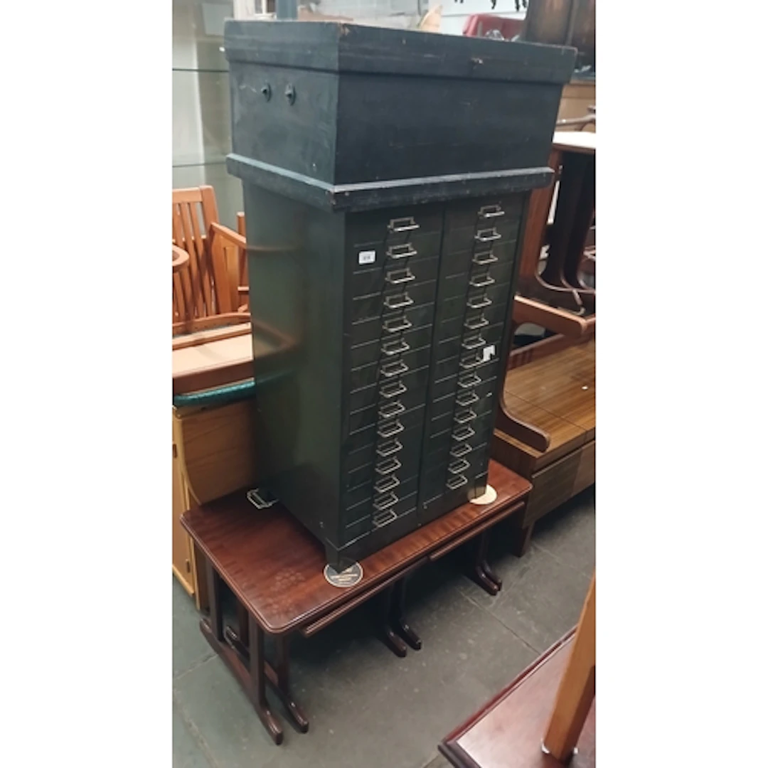 Matal filing drawers, wooden chest and nest of tables.