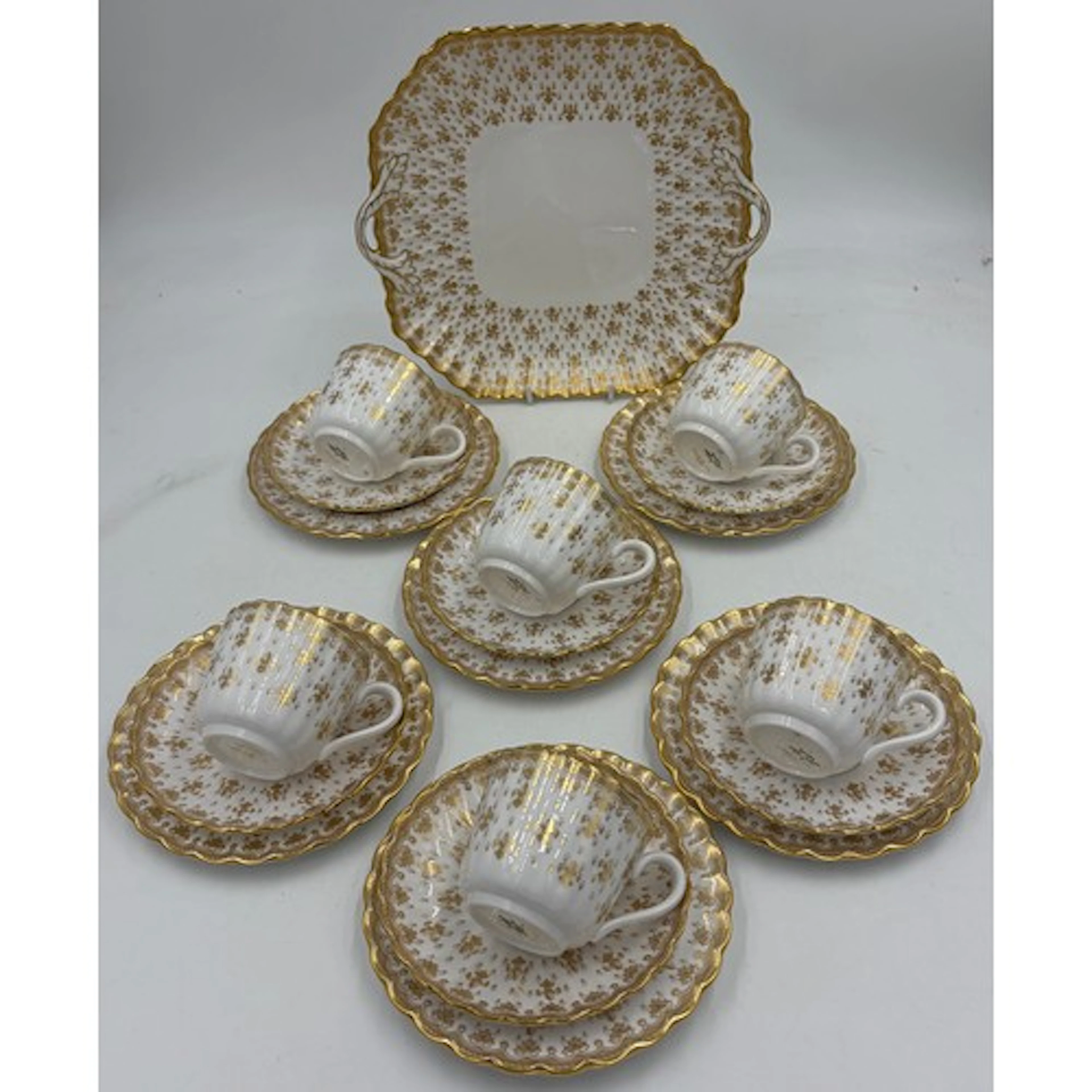 Spode 'Fleur de Lys' gold pattern part tea comprising of cak...