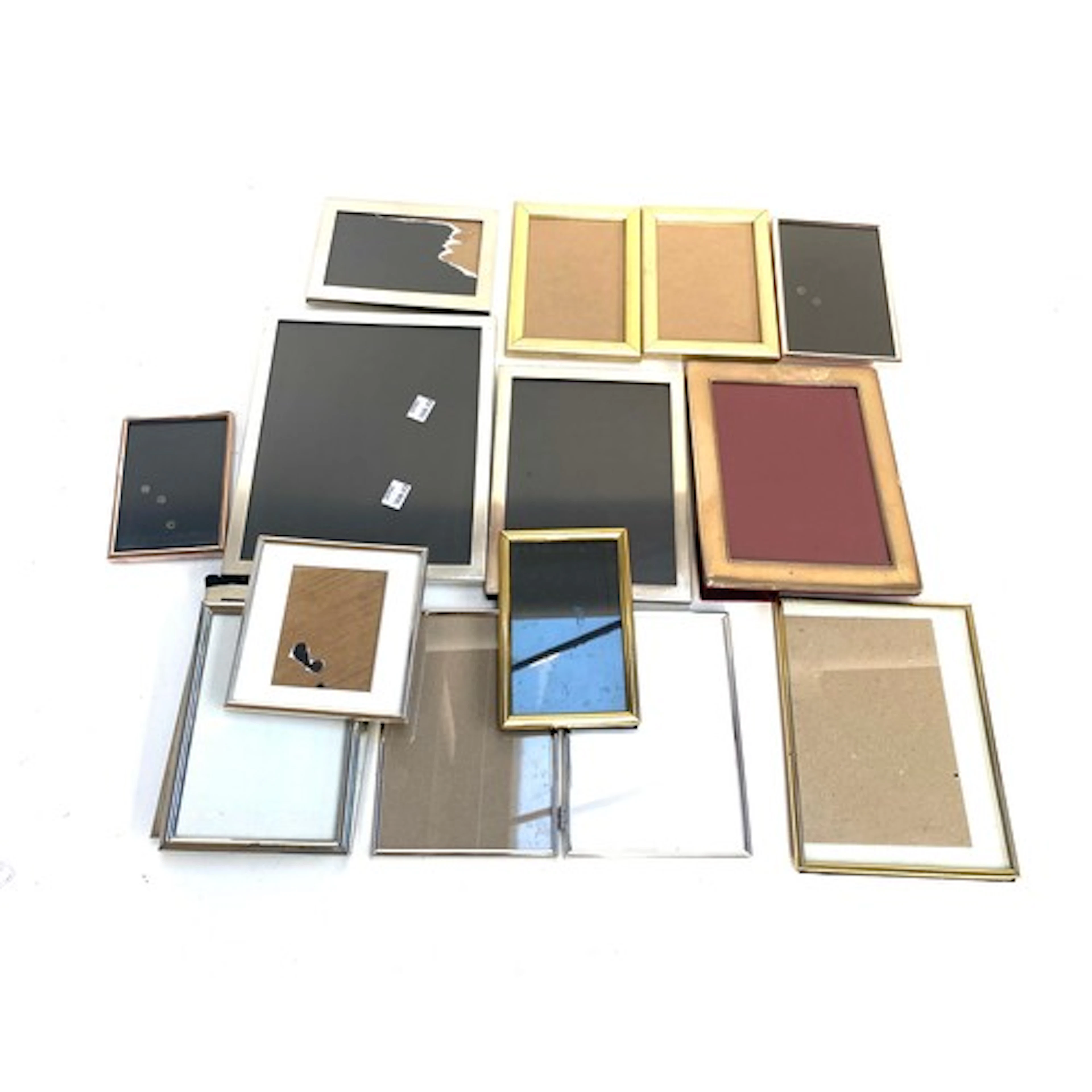 A quantity of silver plated and other photo frames, the larg...
