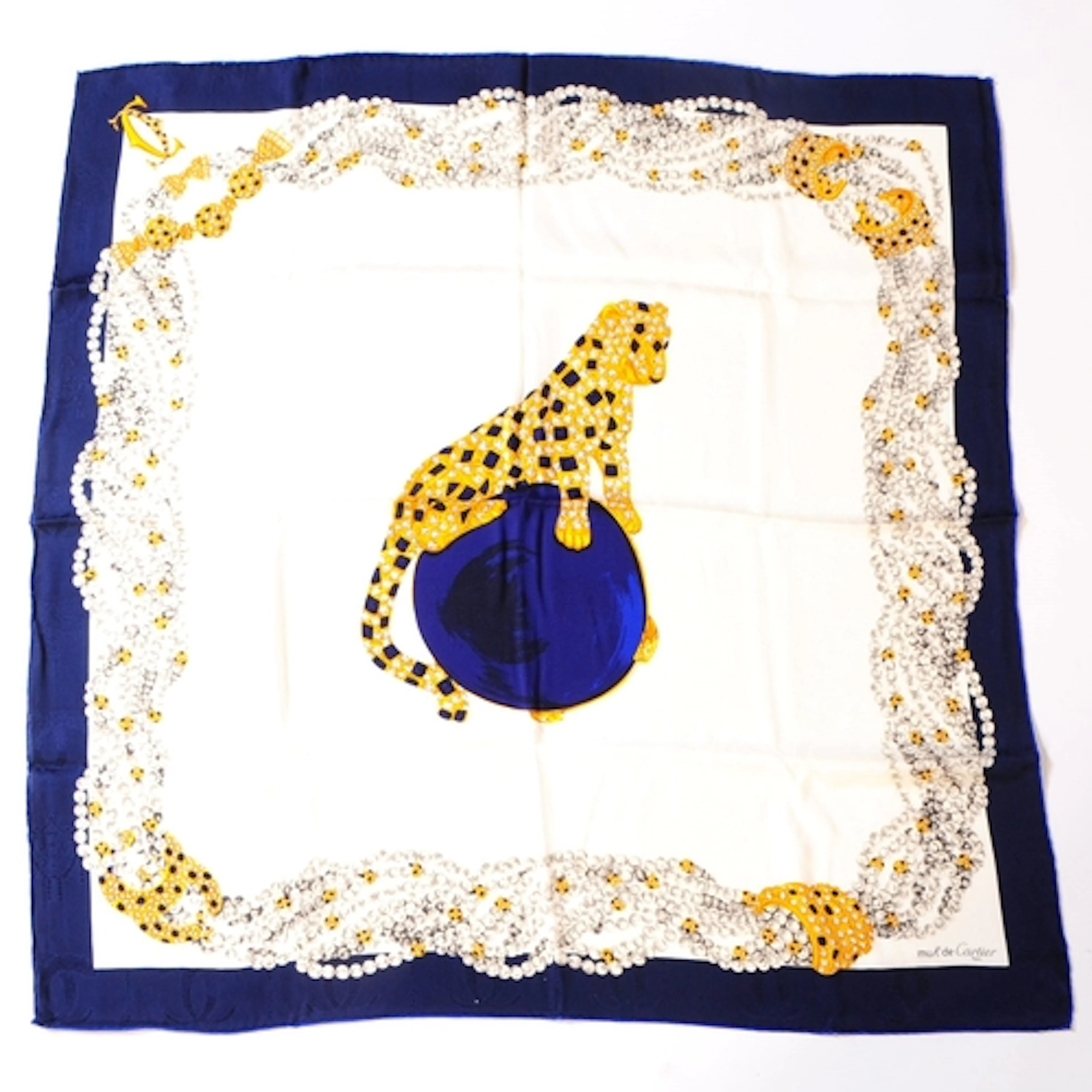 A Must de Cartier Panthere silk scarf. The scarf printed wit...