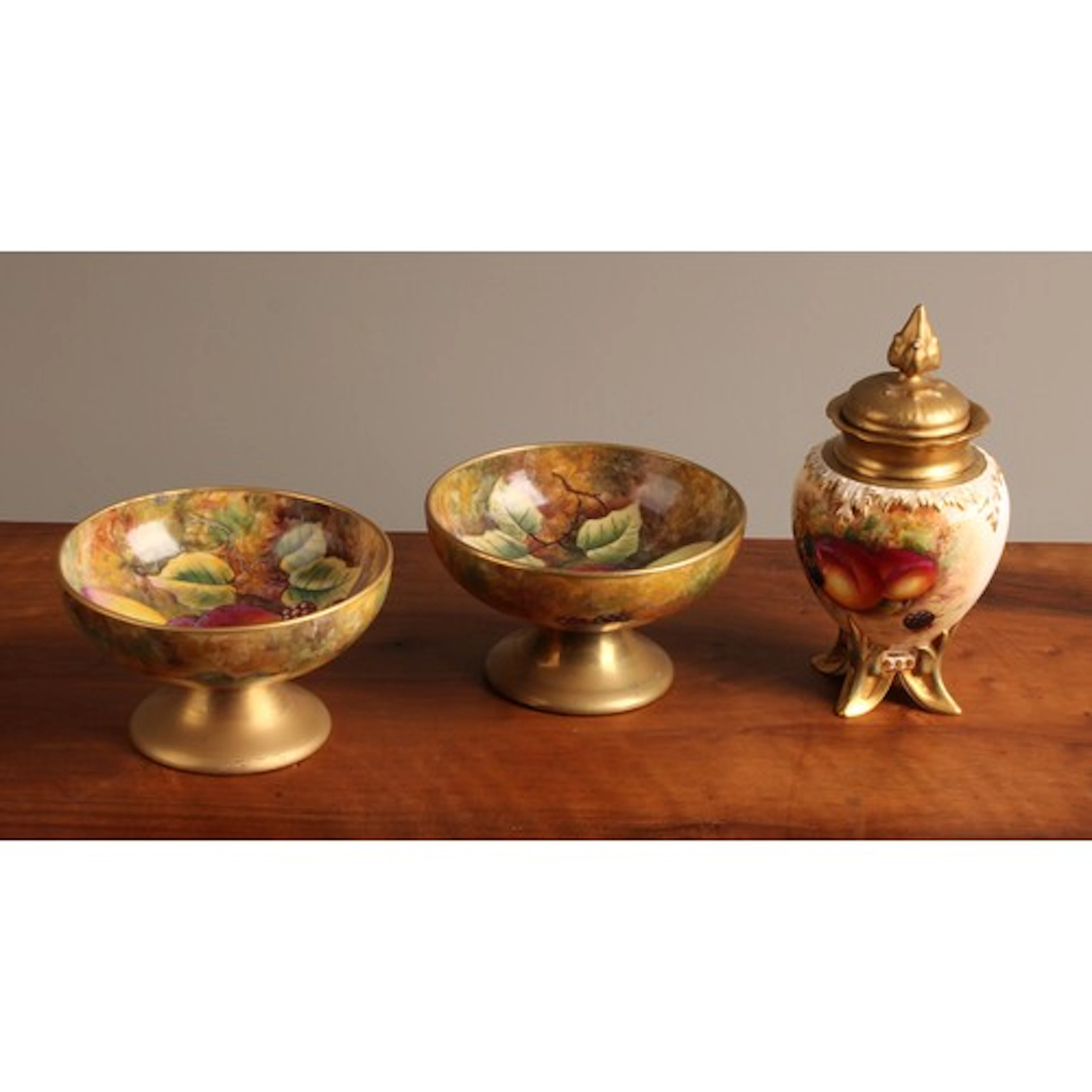 A Royal Worcester ovoid vase and cover, painted with ripe fr...