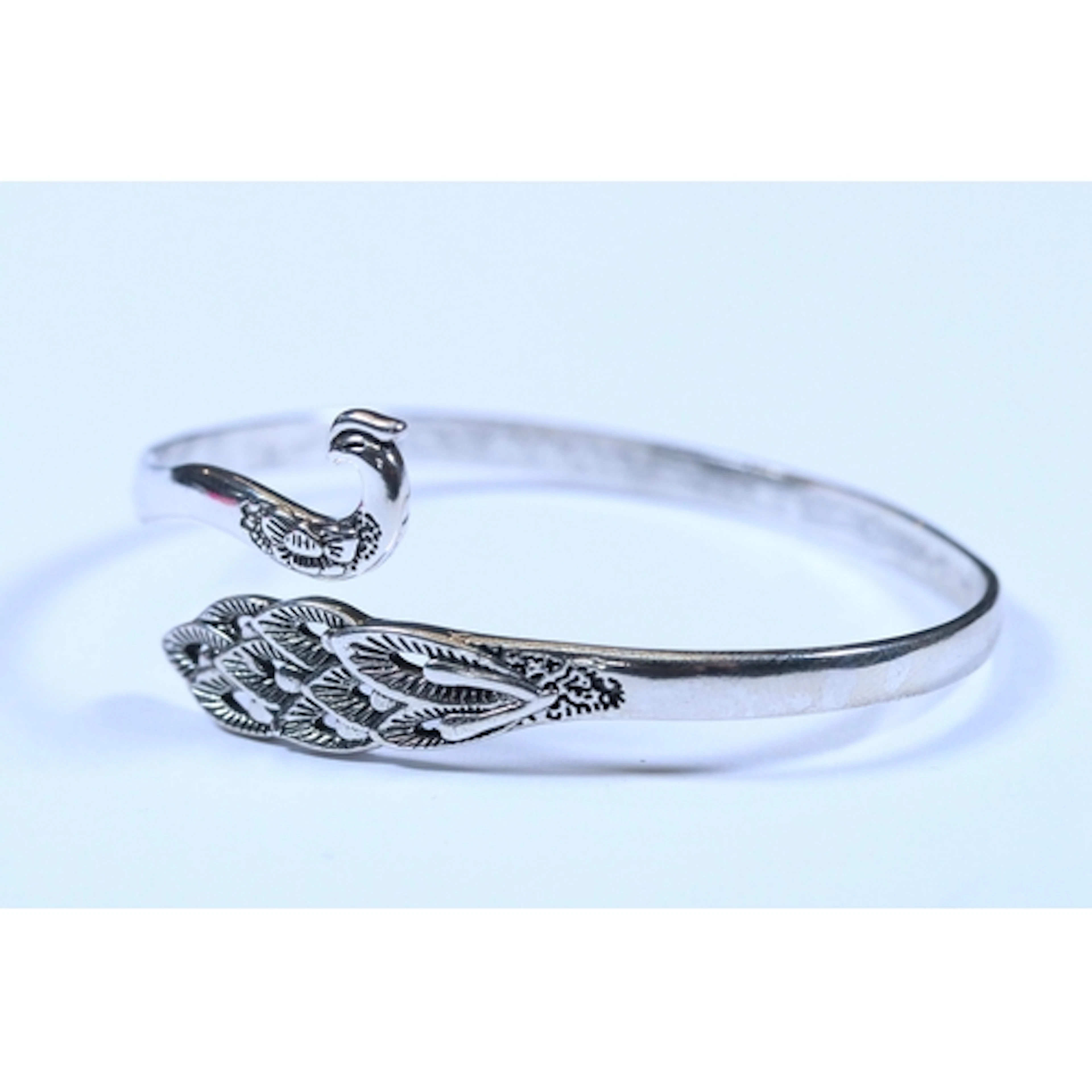 A contemporary 925 sterling silver open fronted peacock bang...