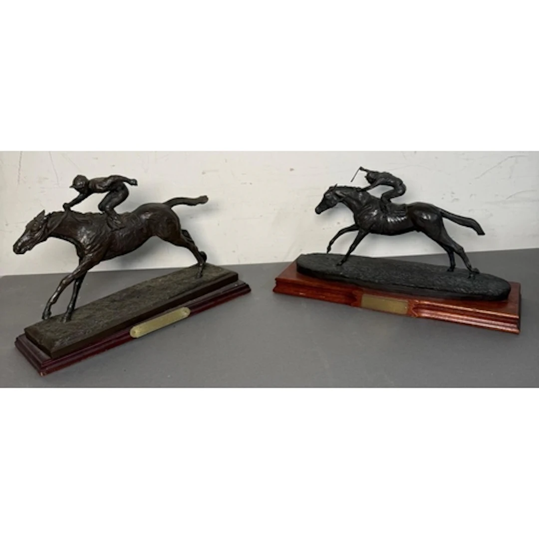 Horse racing interest. Two trophies presented to competitors...