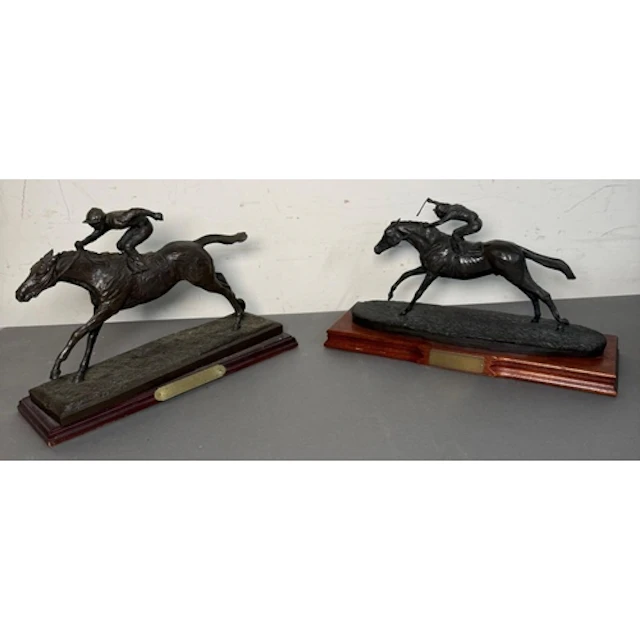 Horse racing interest. Two trophies presented to competitors...