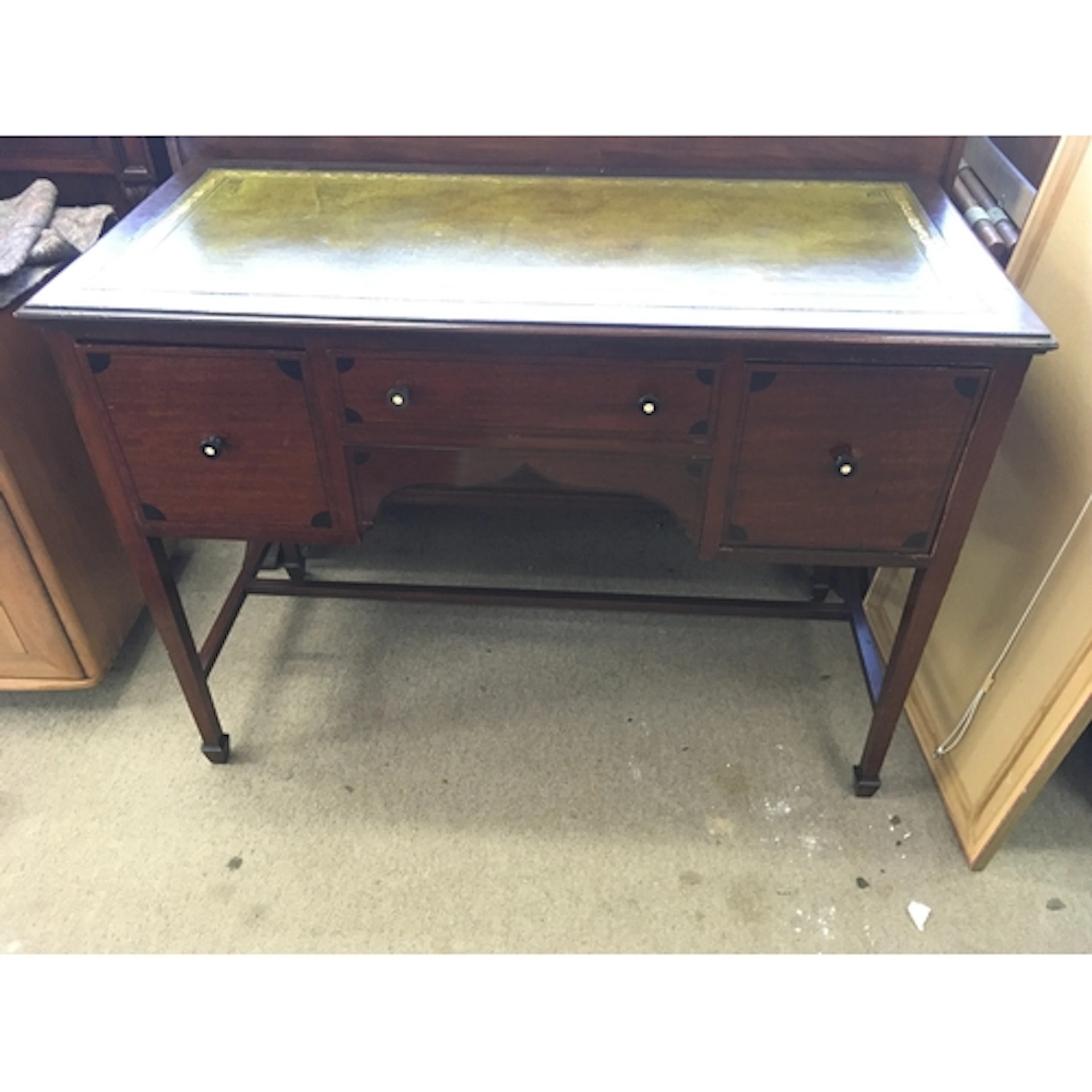 mahogany writing desk with a green, tooled leather writing s...