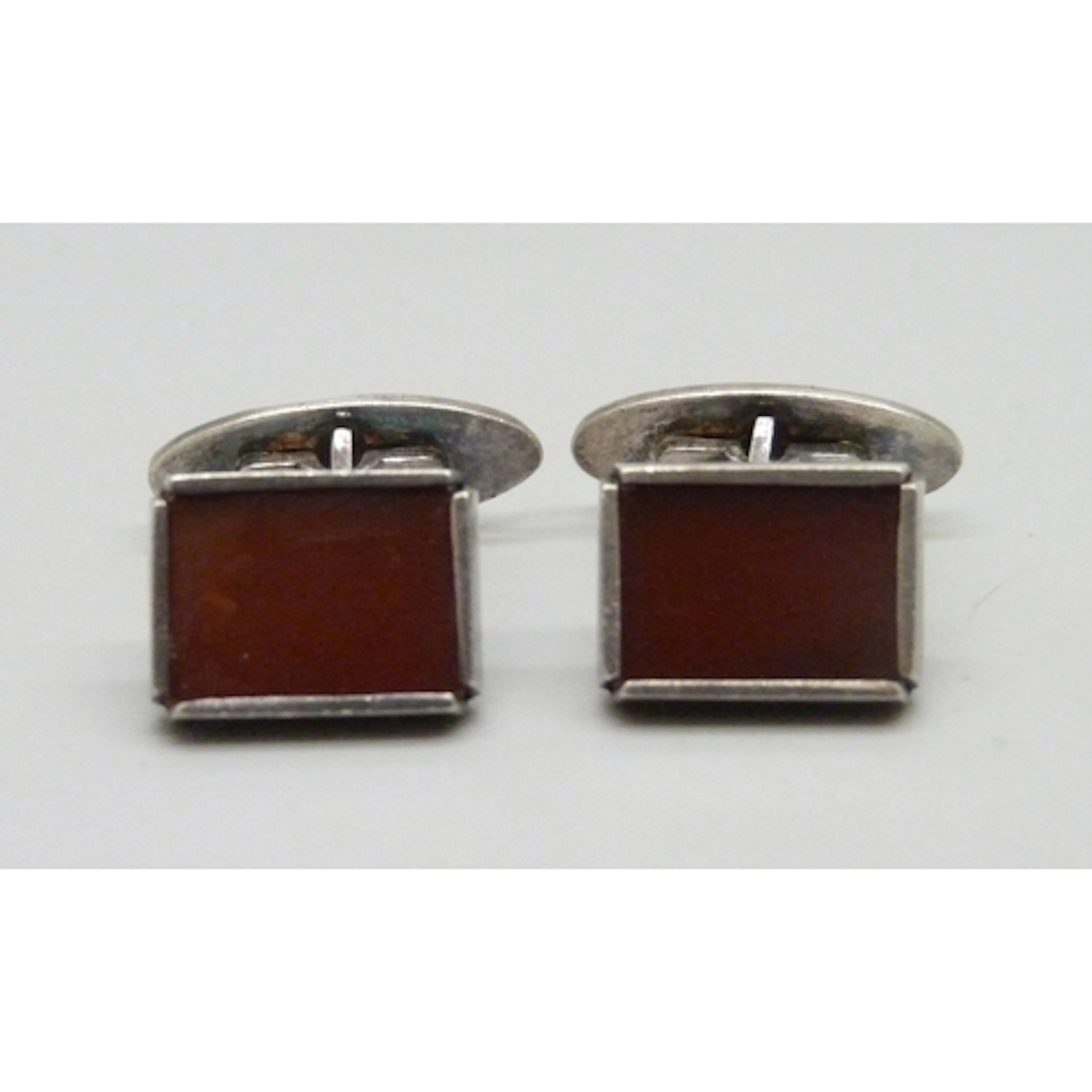 A pair of circa 1970s silver and carnelian Modernist cufflin...