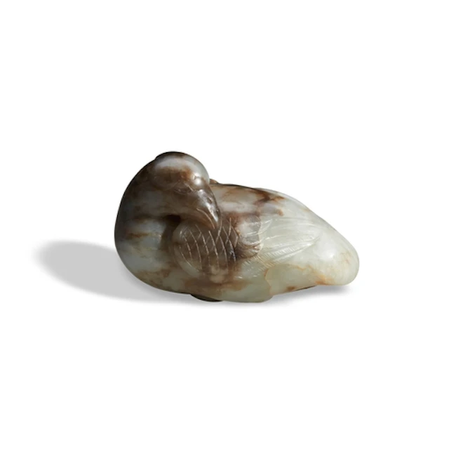 A WHITE AND BLACK JADE 'MANDARIN DUCK' QING DYNASTY, 19TH CE...