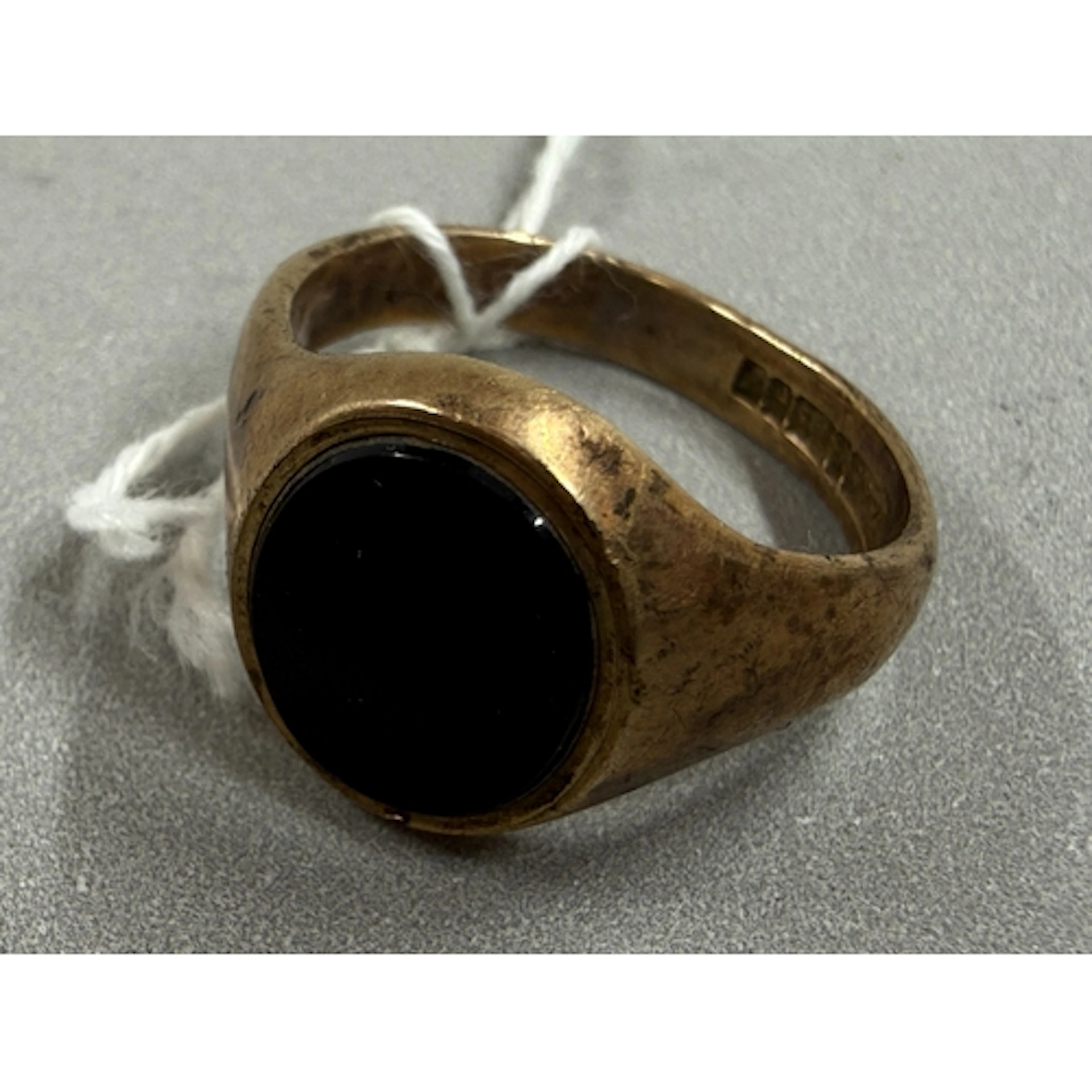 Jewellery: a gentleman's 9ct gold signet ring set an uninscr...