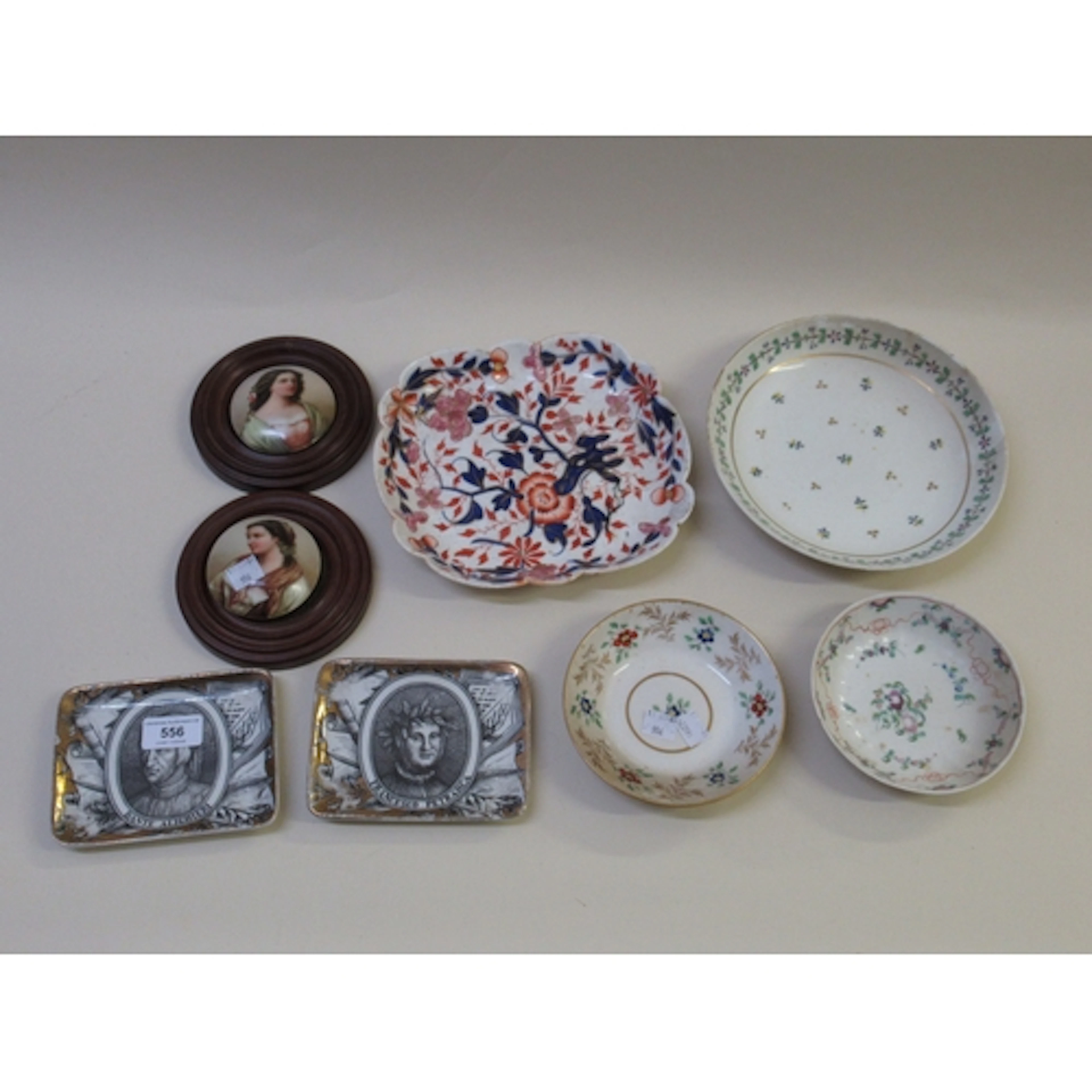 Two Italian Fornasetti rectangular dishes, two circular wood...