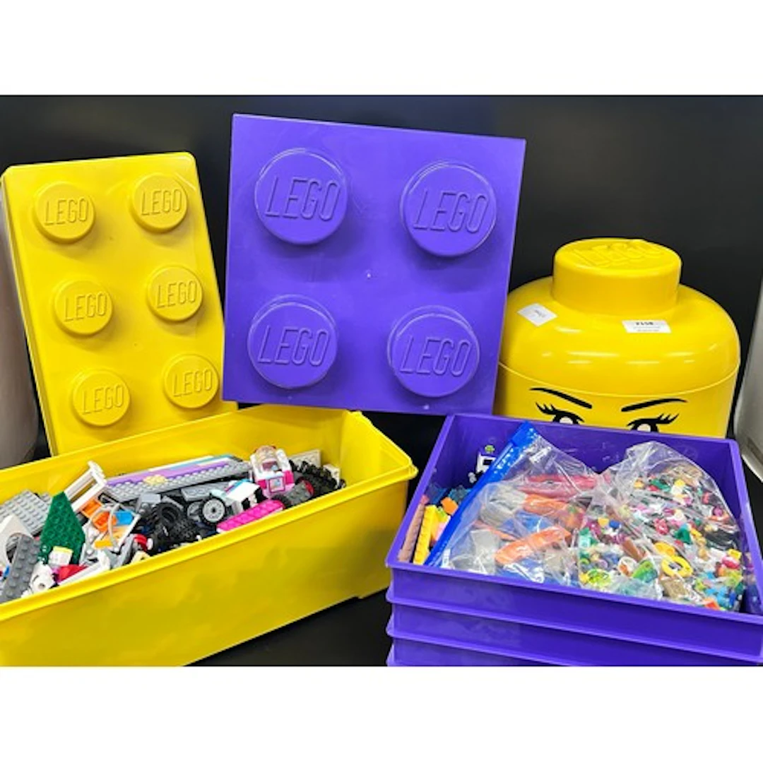 A large collection of Lego pieces and mini-figures, in four ...