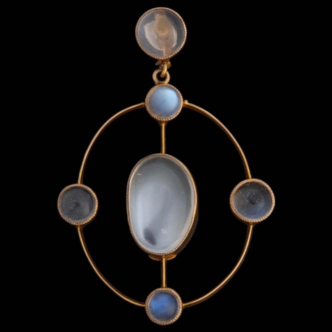 An Edwardian 9ct gold moonstone openwork pendant, circa 1905...